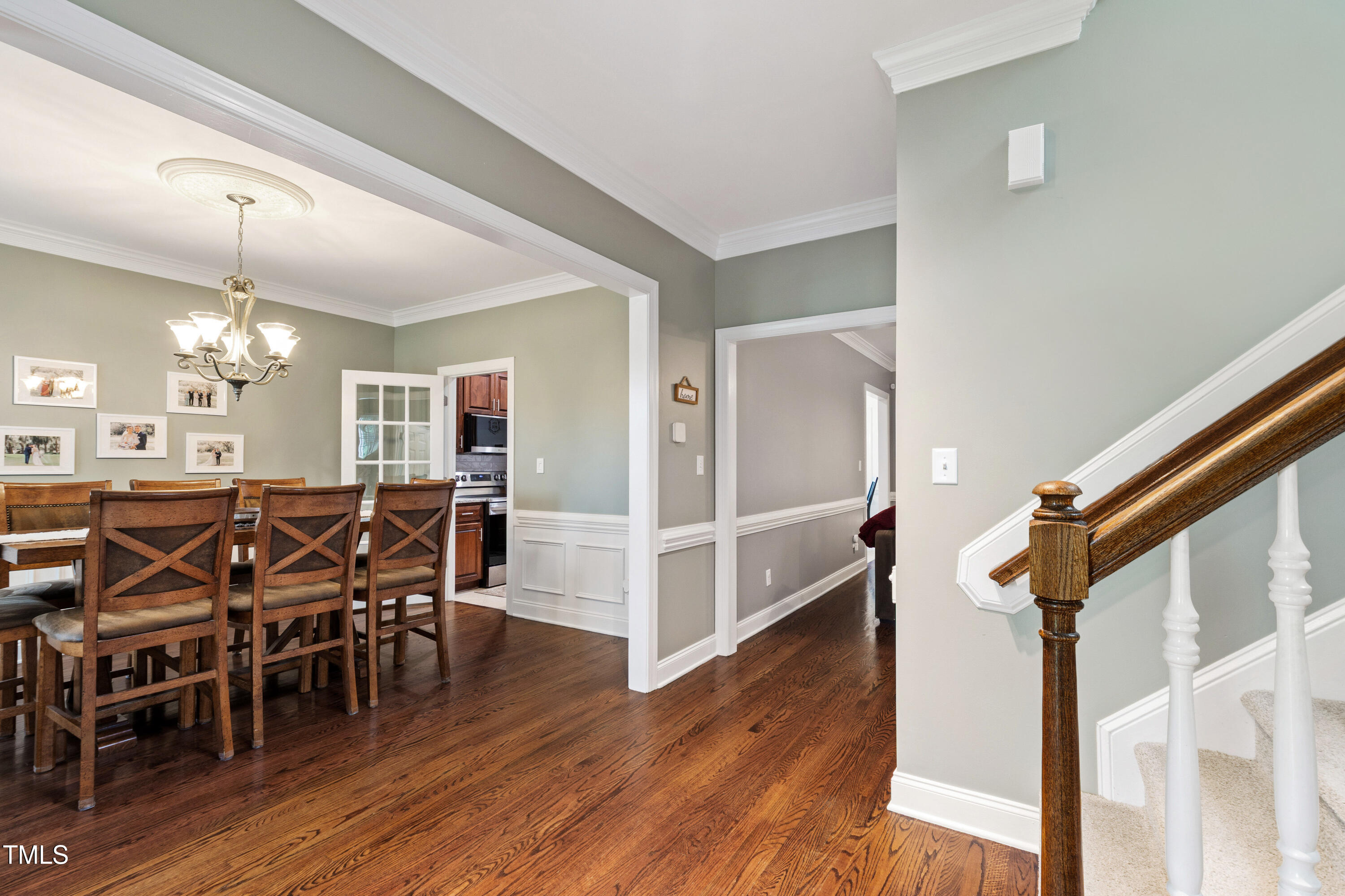 409 Broadmoor Way Clayton, NC 27520 - Photo 14 of 55 a view of a dining room with furniture and wooden floor