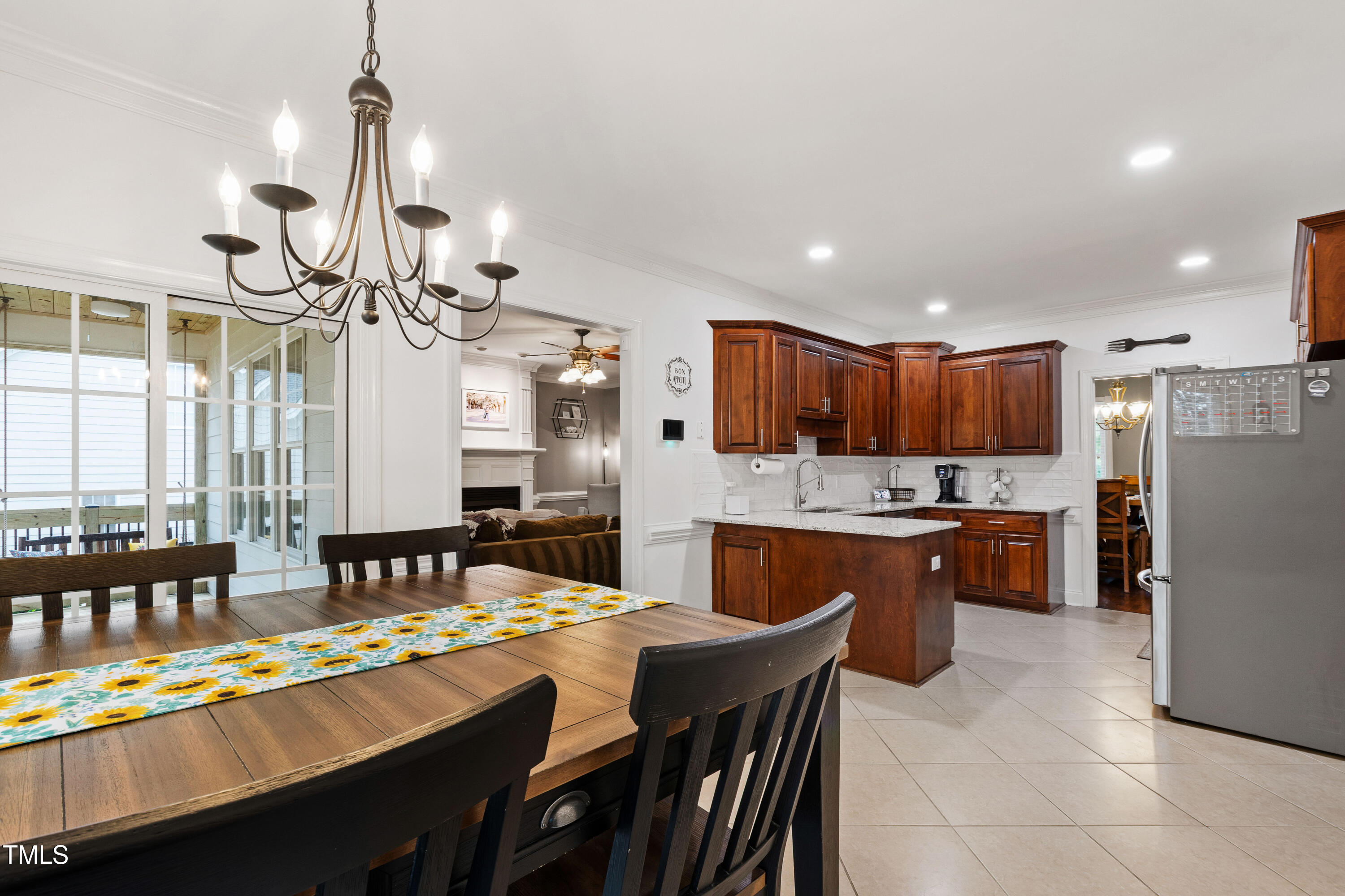 409 Broadmoor Way Clayton, NC 27520 - Photo 22 of 55 a kitchen with stainless steel appliances granite countertop a sink a stove and a refrigerator