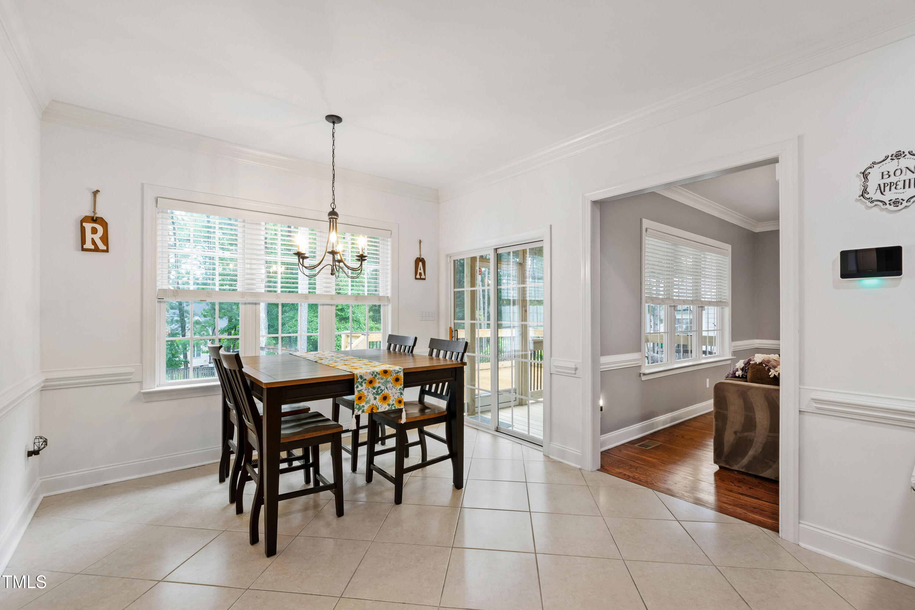 409 Broadmoor Way Clayton, NC 27520 - Photo 24 of 55 a dining room with furniture and large windows