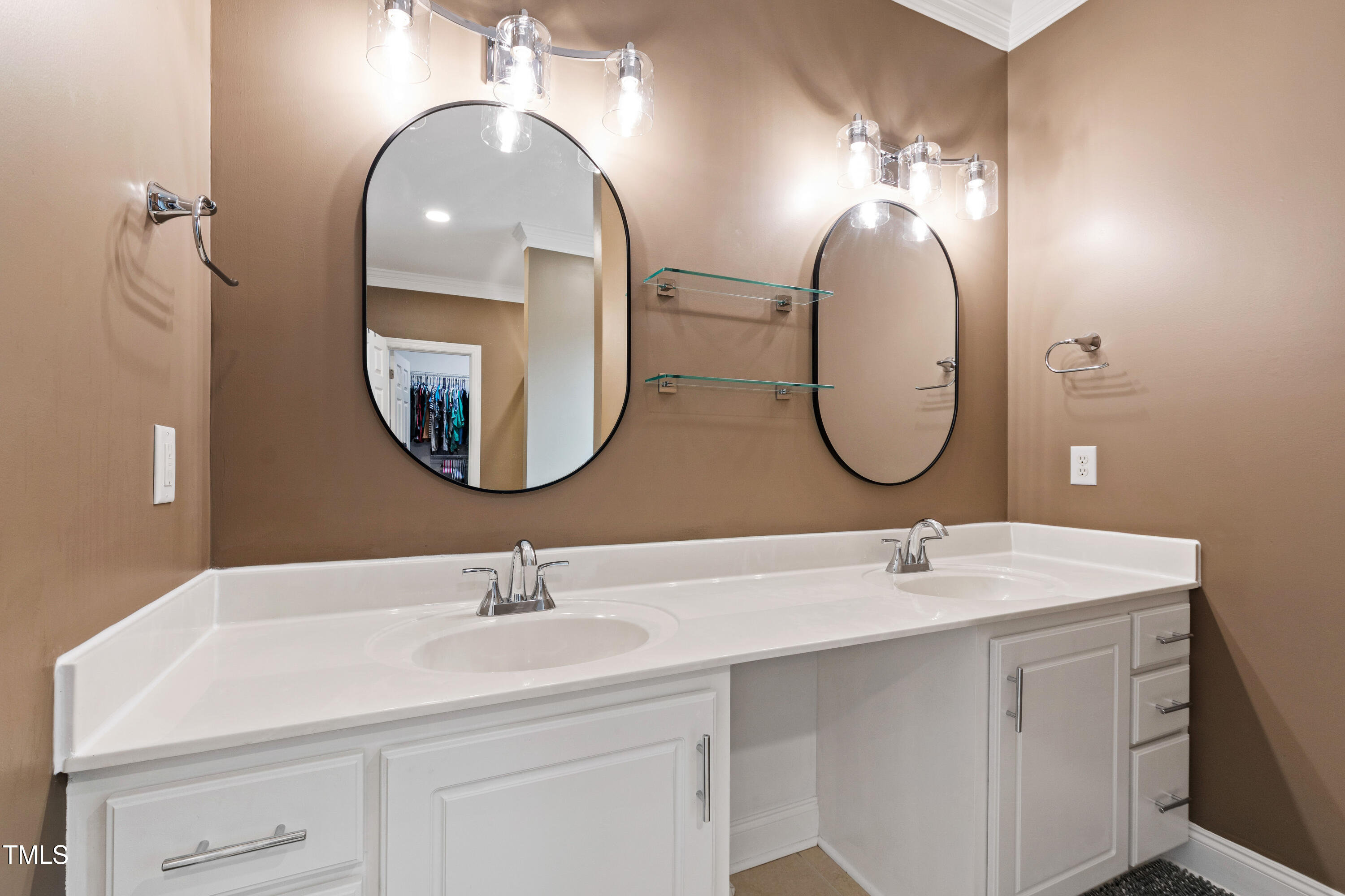 409 Broadmoor Way Clayton, NC 27520 - Photo 28 of 55 a bathroom with a double vanity sink and a mirror