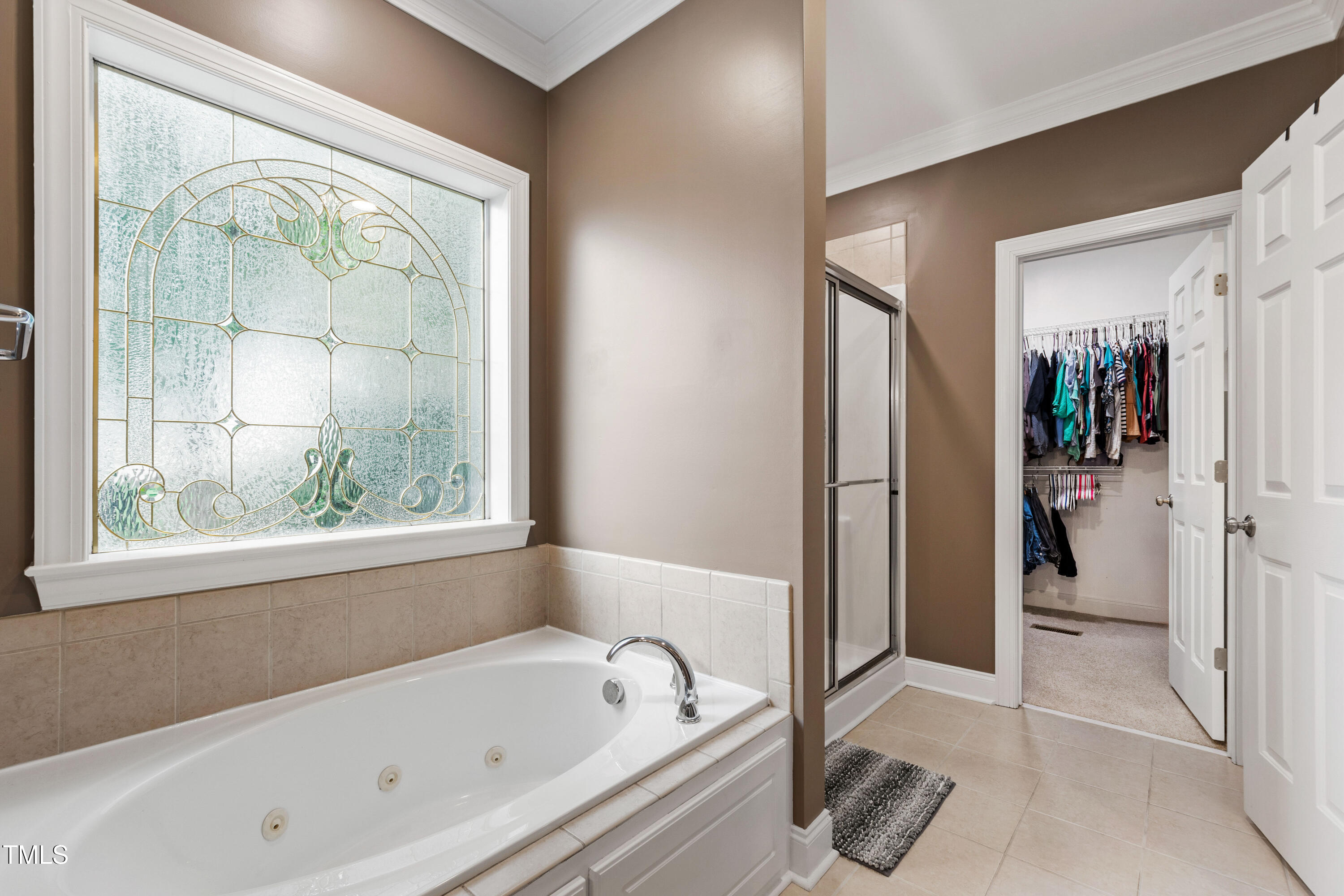 409 Broadmoor Way Clayton, NC 27520 - Photo 29 of 55 a bathroom with a bathtub and a shower