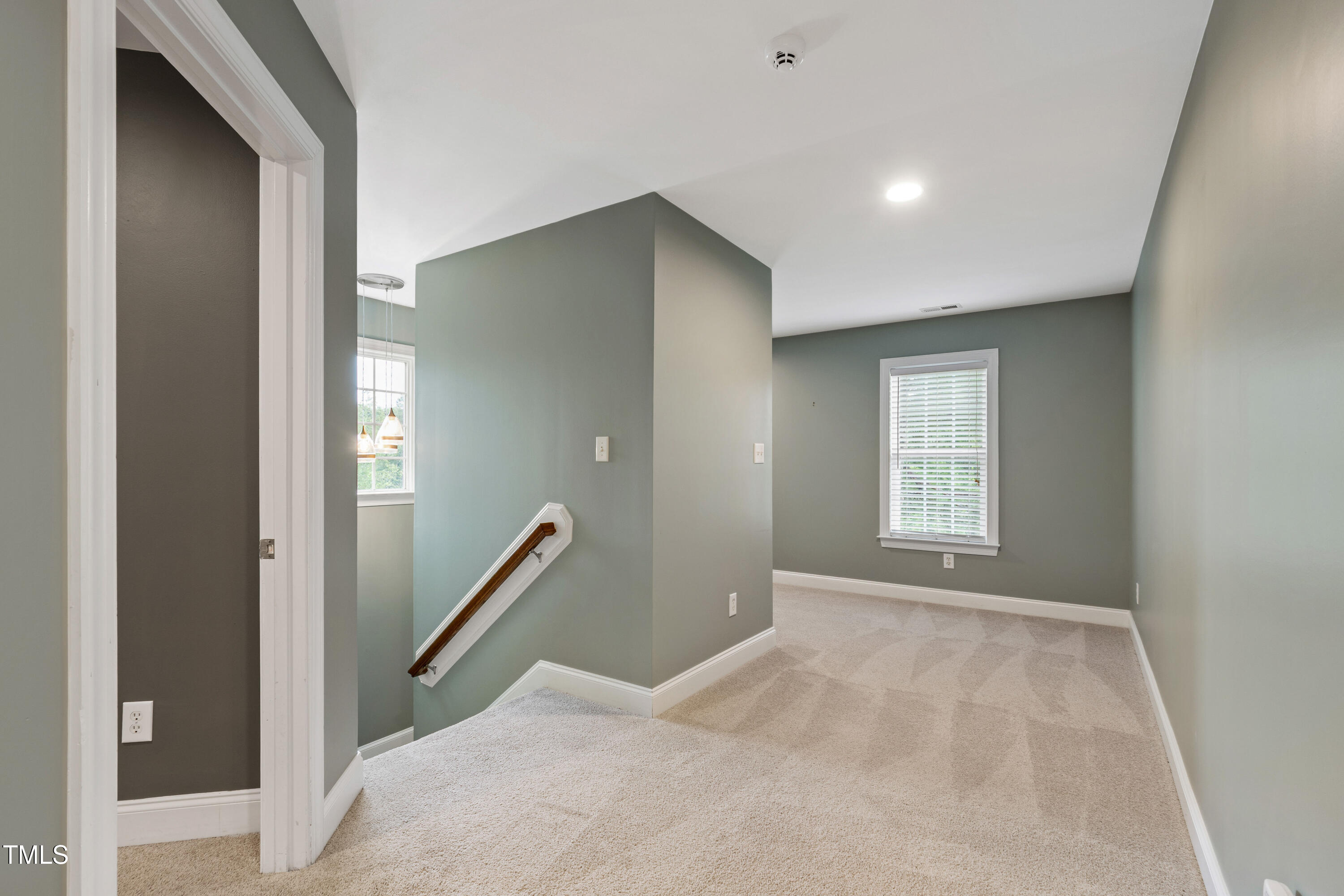 409 Broadmoor Way Clayton, NC 27520 - Photo 32 of 55 a view of empty room with wooden floor and fan