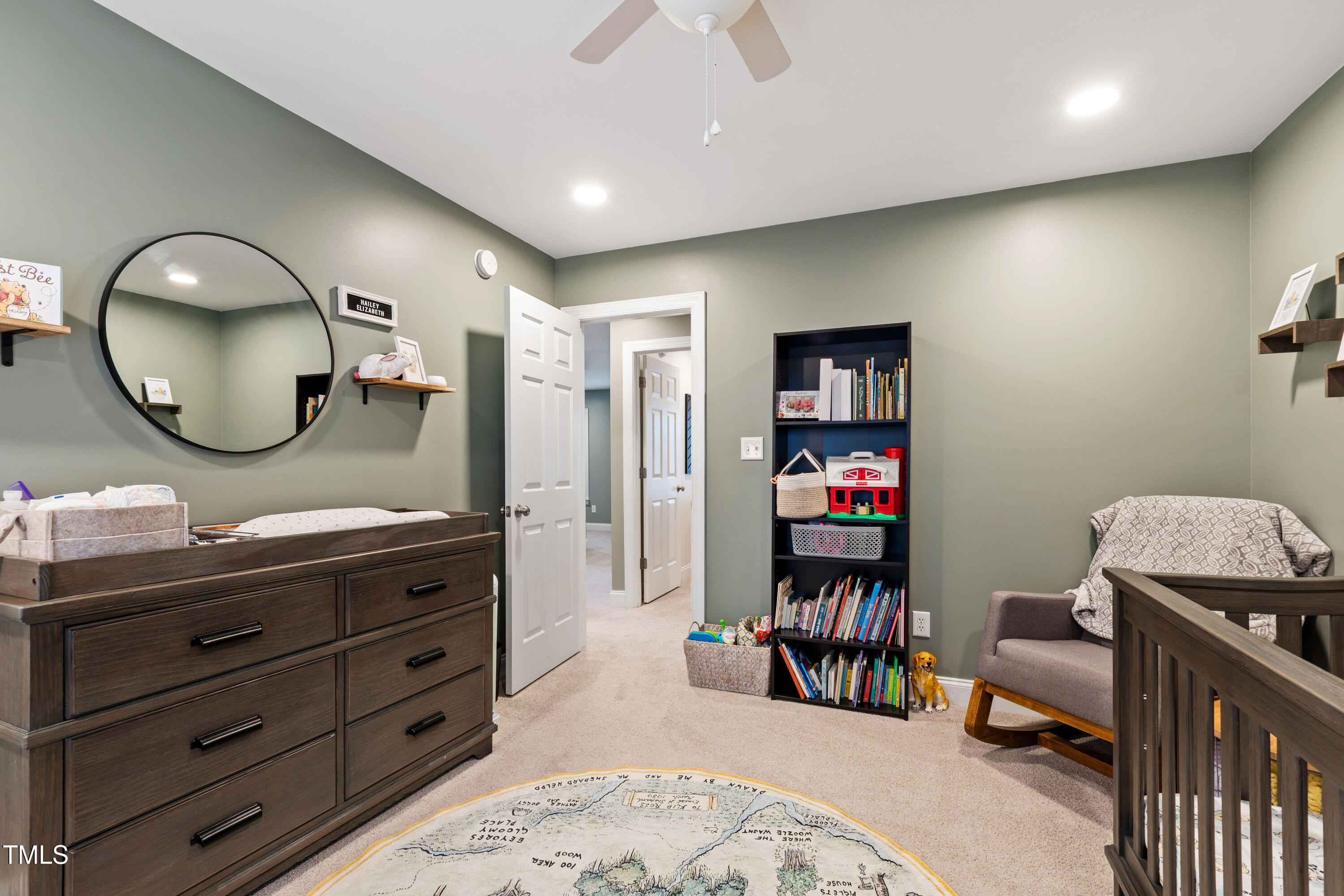 409 Broadmoor Way Clayton, NC 27520 - Photo 37 of 55 a kids room with a bed and a mirror