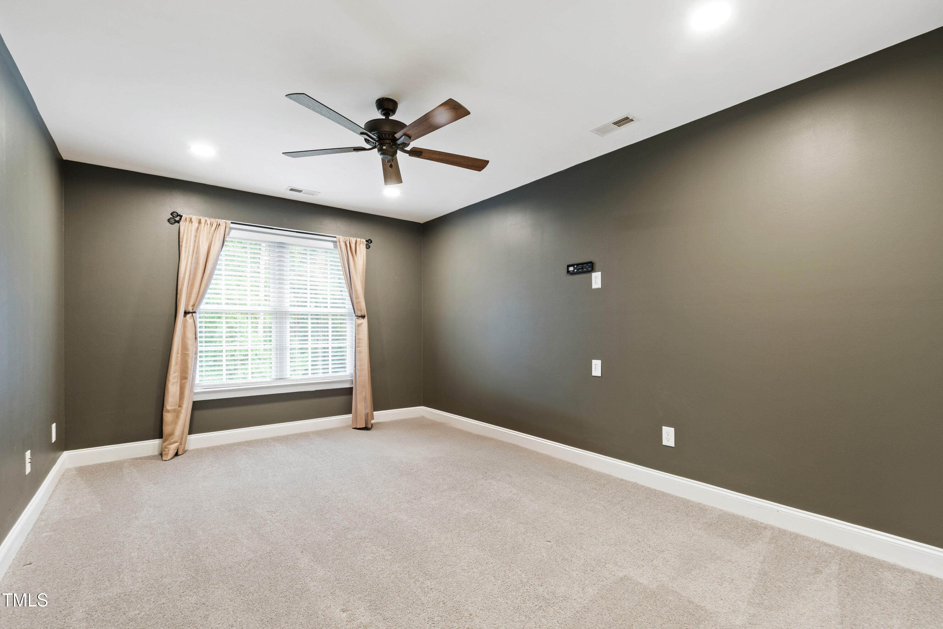 409 Broadmoor Way Clayton, NC 27520 - Photo 40 of 55 a view of an empty room with a window