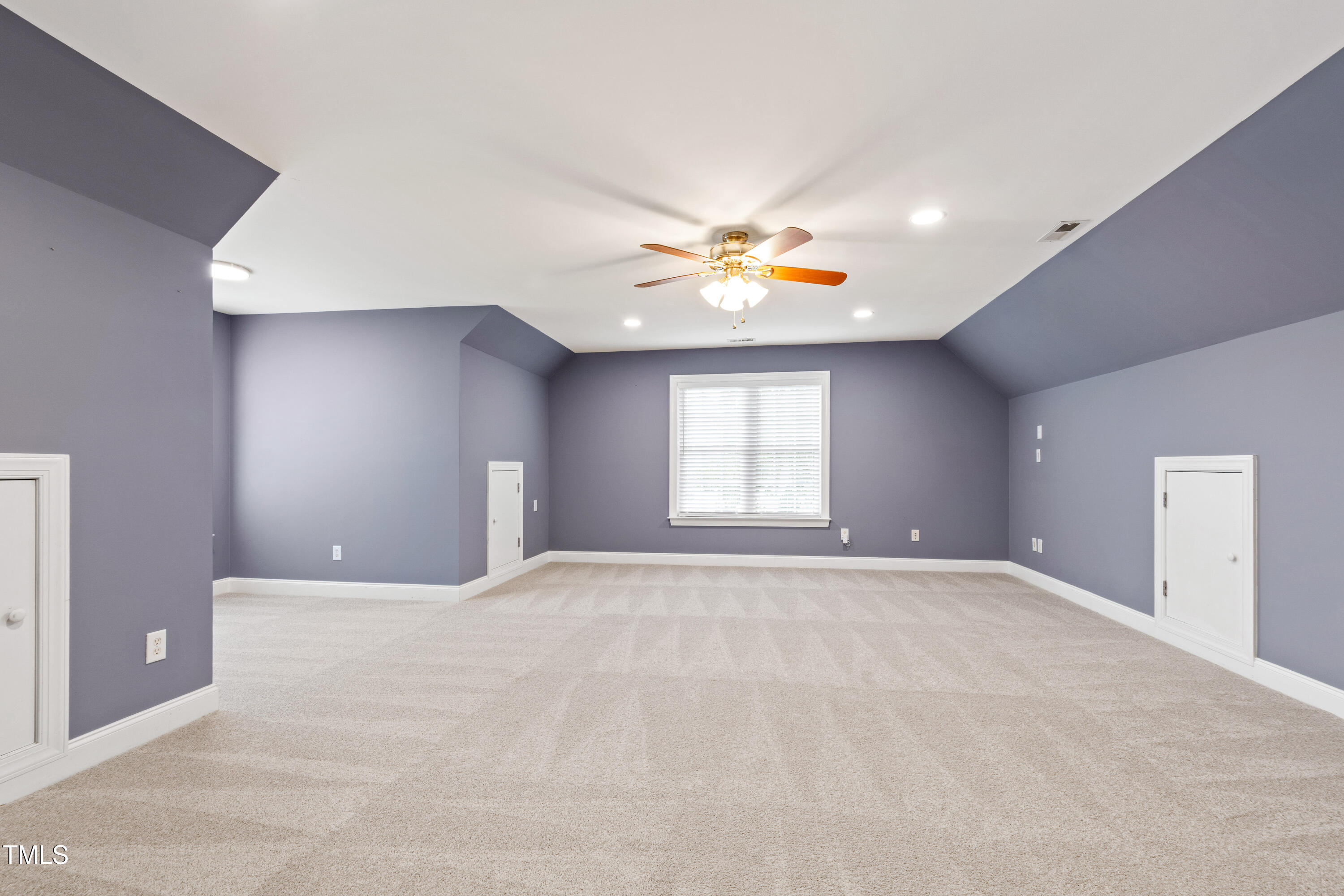 409 Broadmoor Way Clayton, NC 27520 - Photo 41 of 55 a view of an empty room with a window