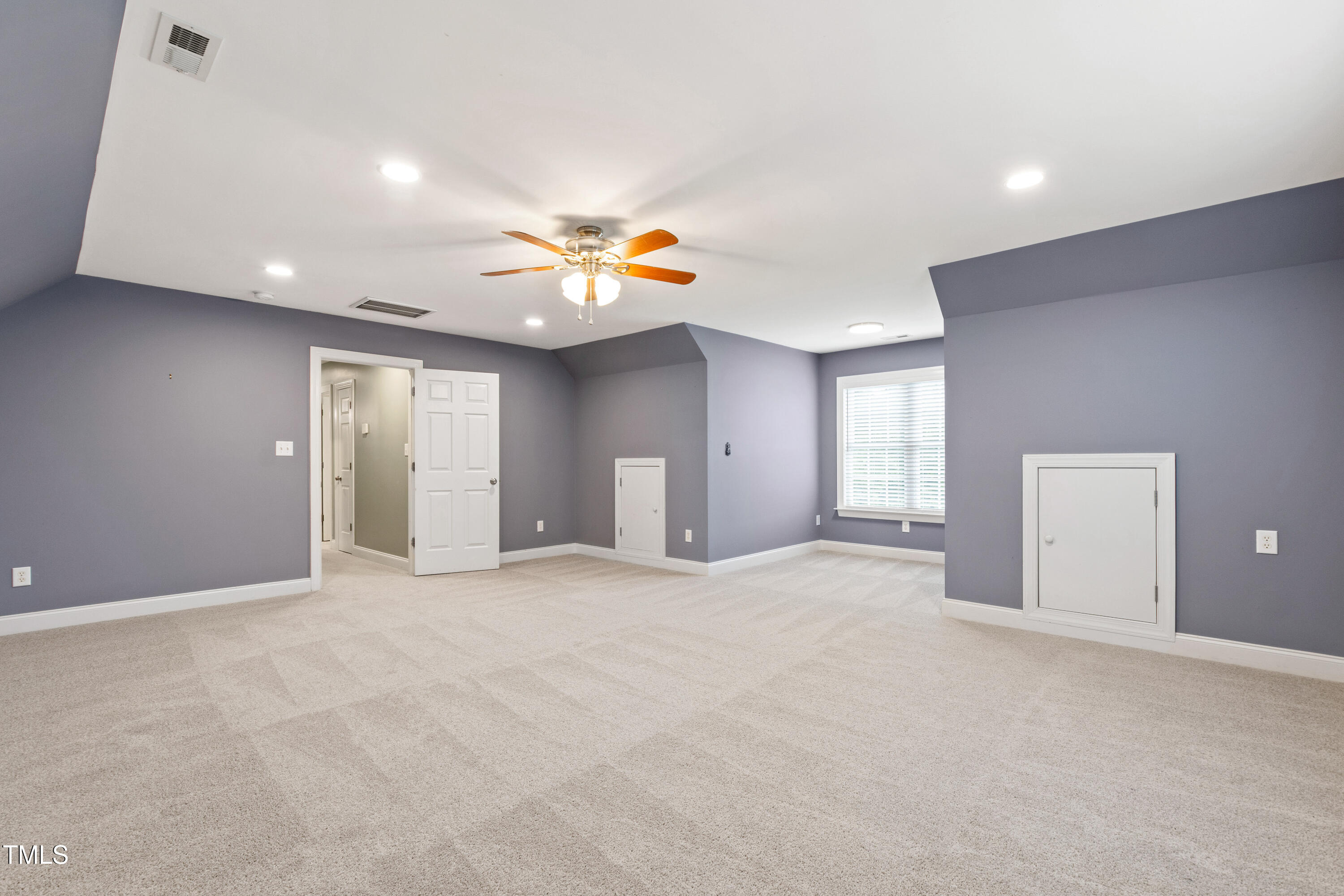409 Broadmoor Way Clayton, NC 27520 - Photo 42 of 55 a view of an empty room with a window
