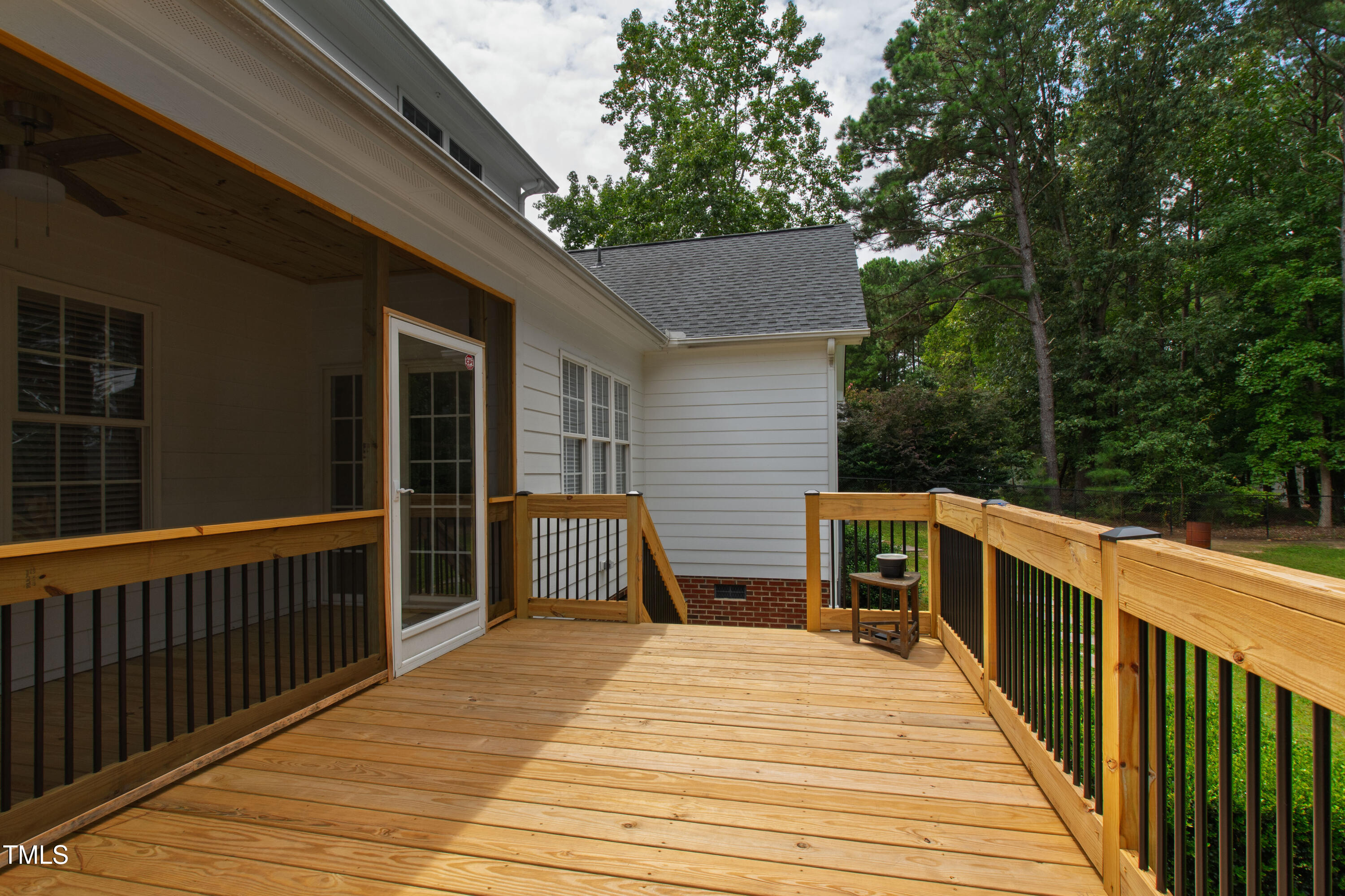 409 Broadmoor Way Clayton, NC 27520 - Photo 48 of 55 a view of a deck with wooden floor and barbeque oven