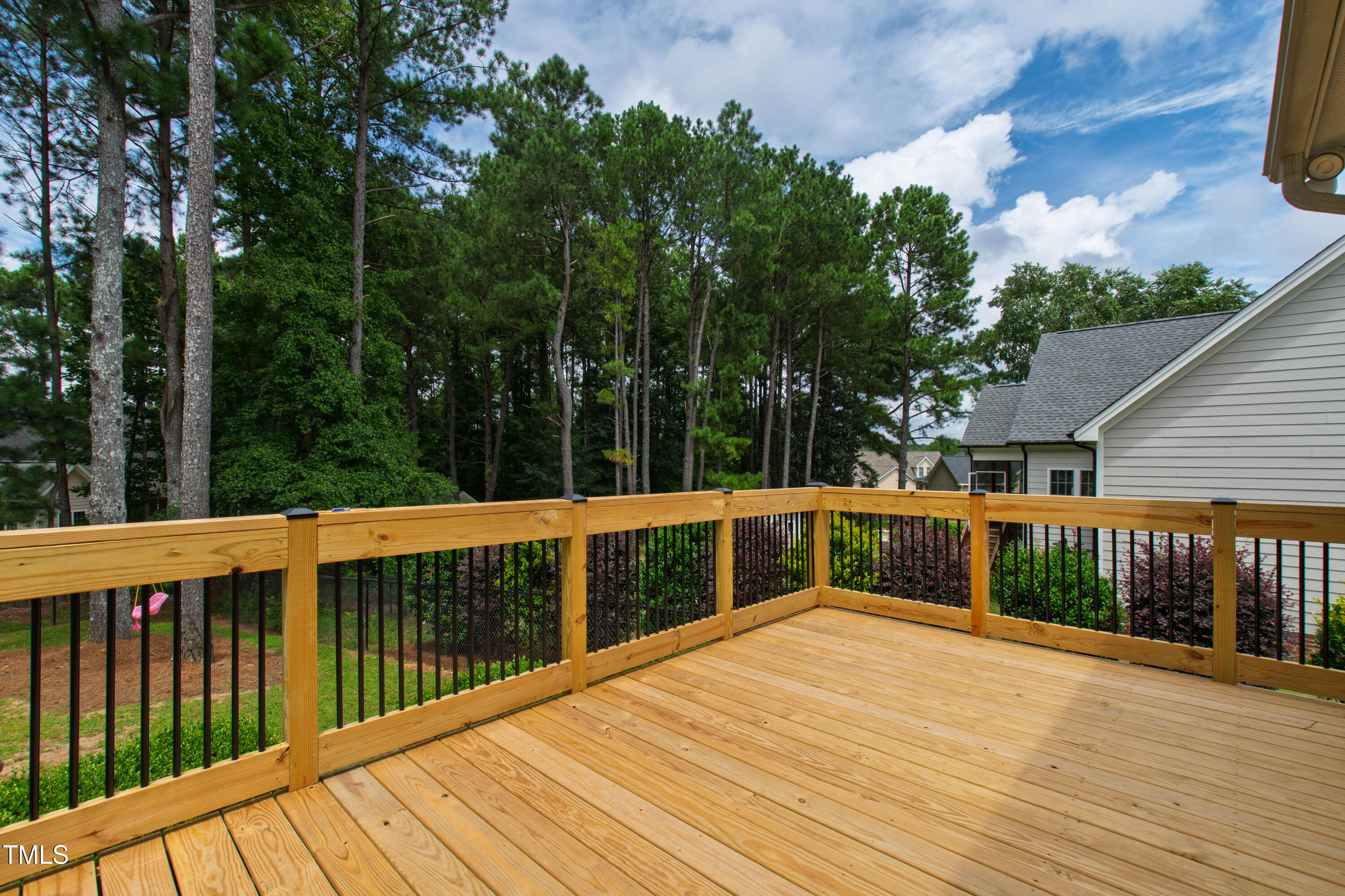 409 Broadmoor Way Clayton, NC 27520 - Photo 49 of 55 a view of balcony with deck and trees