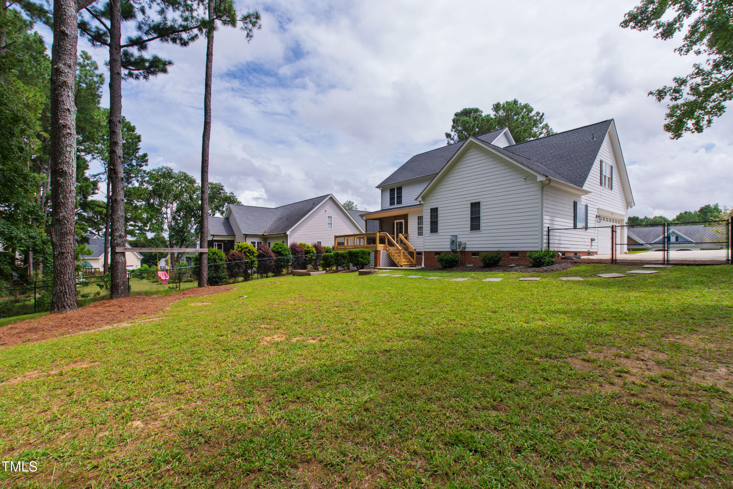 409 Broadmoor Way Clayton, NC 27520 - Photo 51 of 55 a view of a house with a yard and potted plants
