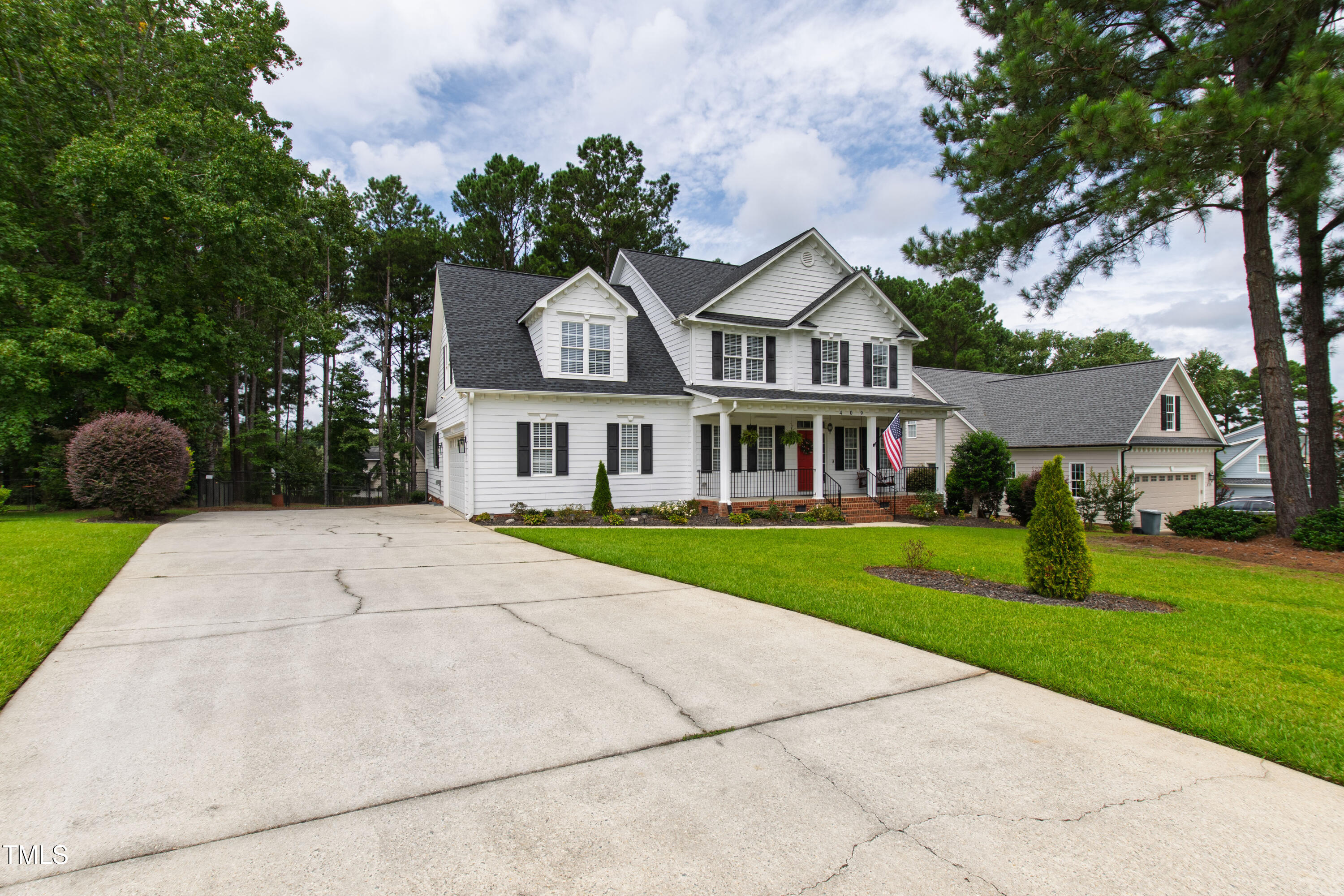 409 Broadmoor Way Clayton, NC 27520 - Photo 54 of 55 a front view of a house with a yard and trees