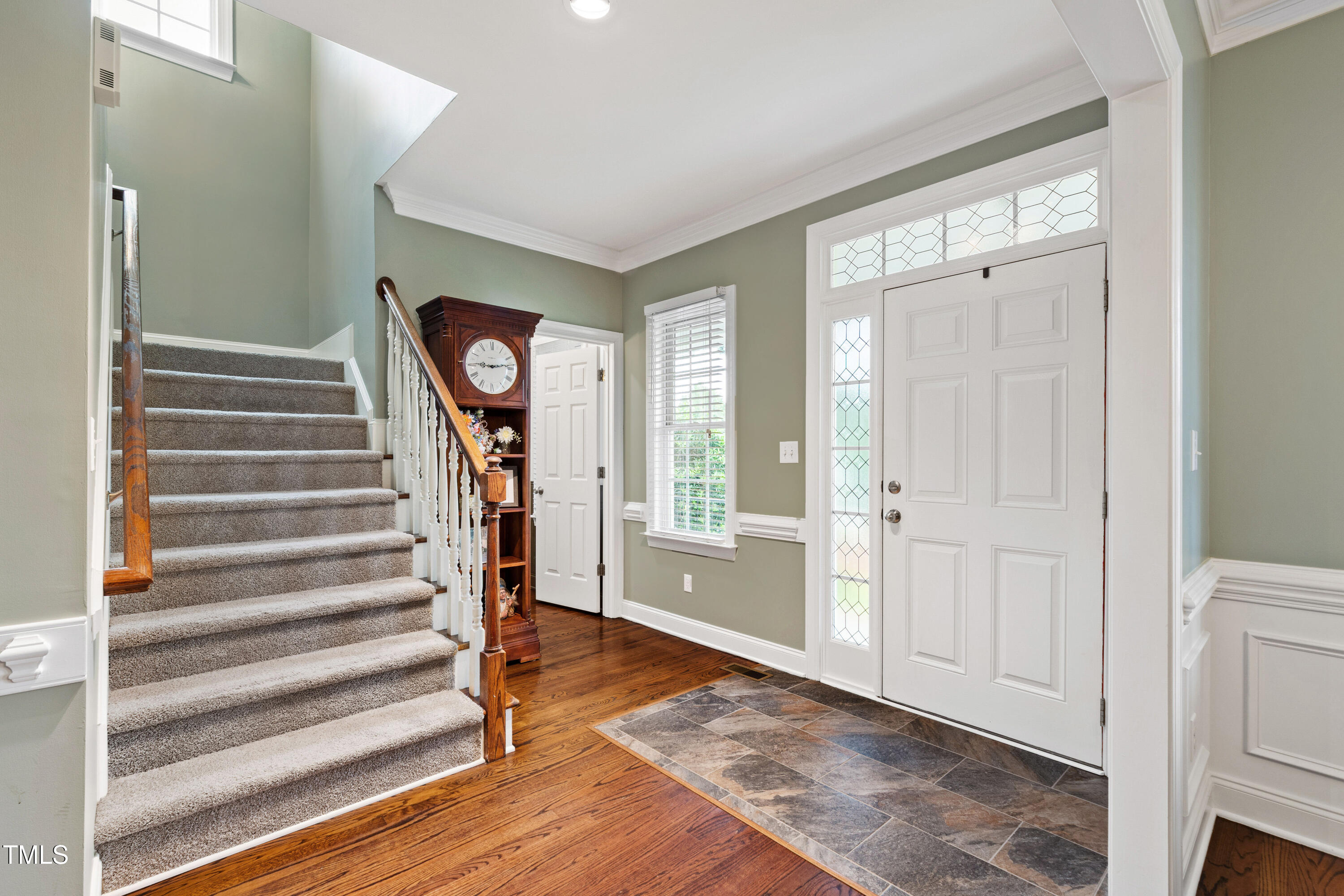 409 Broadmoor Way Clayton, NC 27520 - Photo 6 of 55 a view of an entryway with wooden floor and staircase