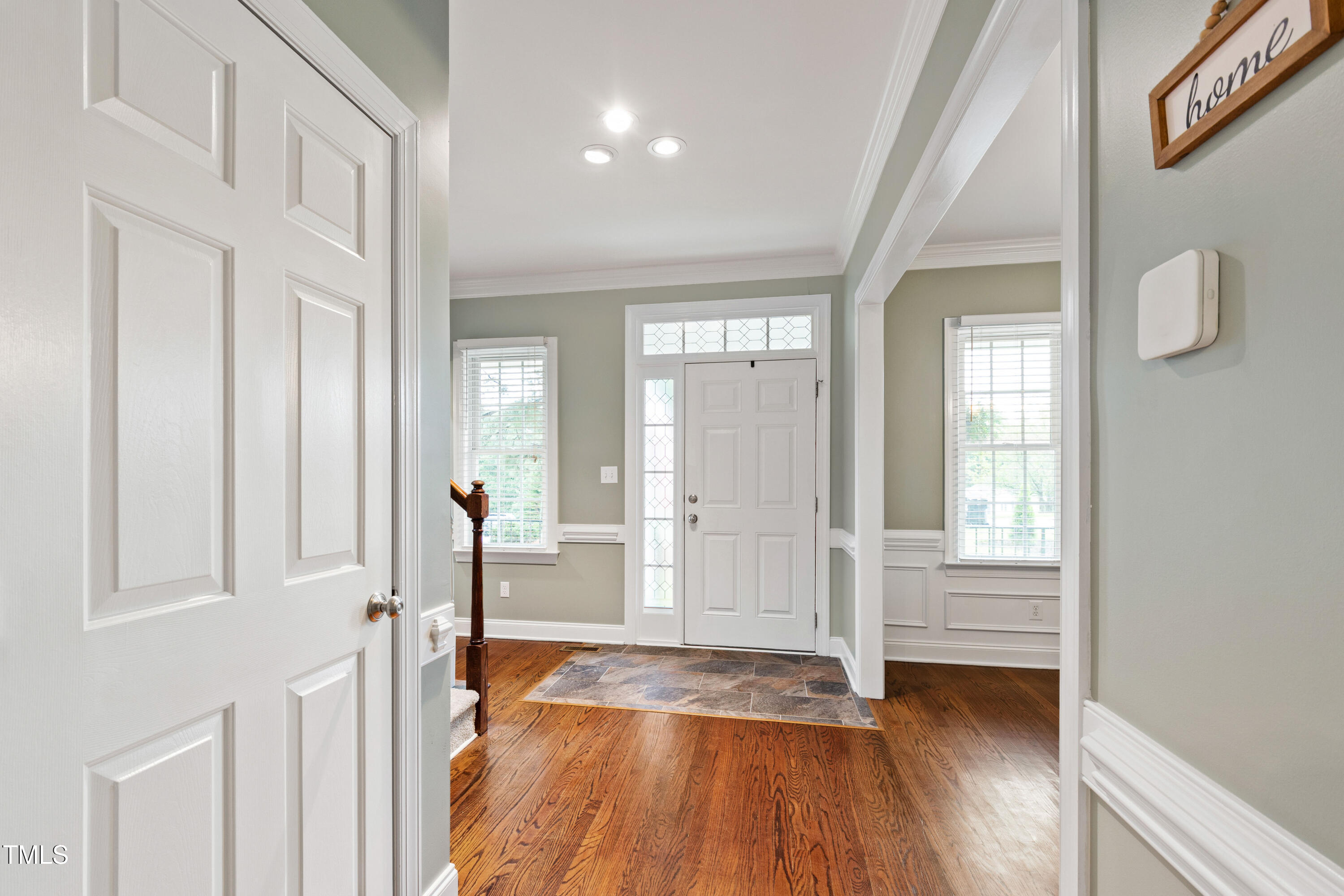 409 Broadmoor Way Clayton, NC 27520 - Photo 7 of 55 a view of an entryway with wooden floor