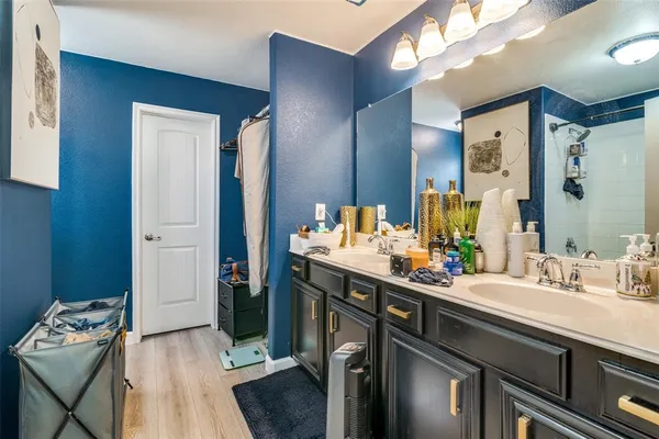 a bathroom with a sink double vanity and a mirror