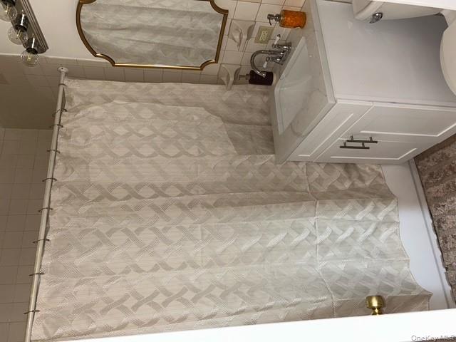 236 Utica Avenue, Unit 3F Brooklyn, NY 11213 - Photo 7 of 8 a bathroom with a sink and a mirror