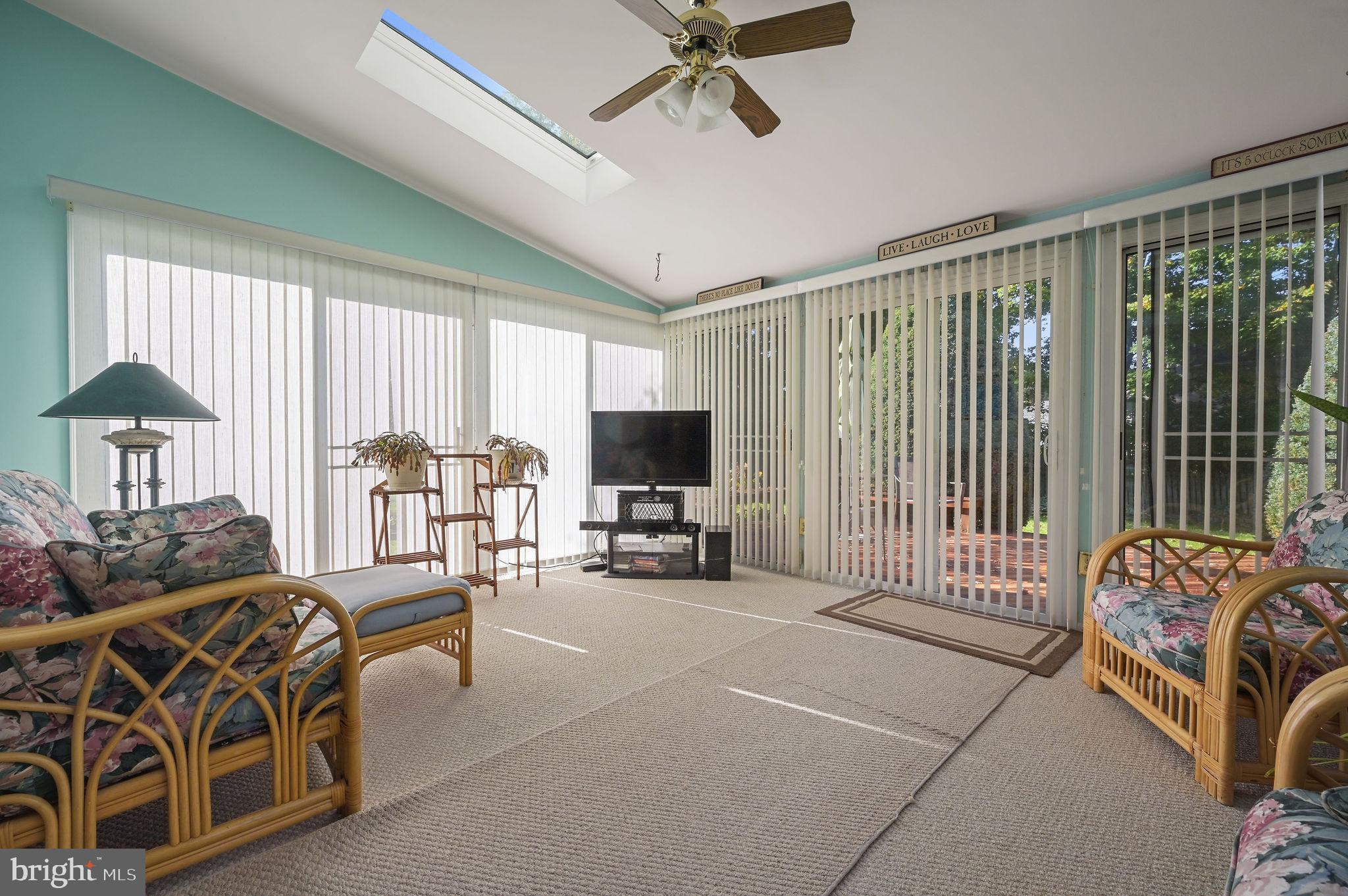 164 Burning Tree Road Dover, DE 19904 - Photo 14 of 37 a living room with furniture and a flat screen tv