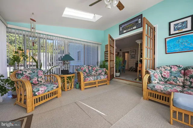 a bedroom with furniture and a flat screen tv