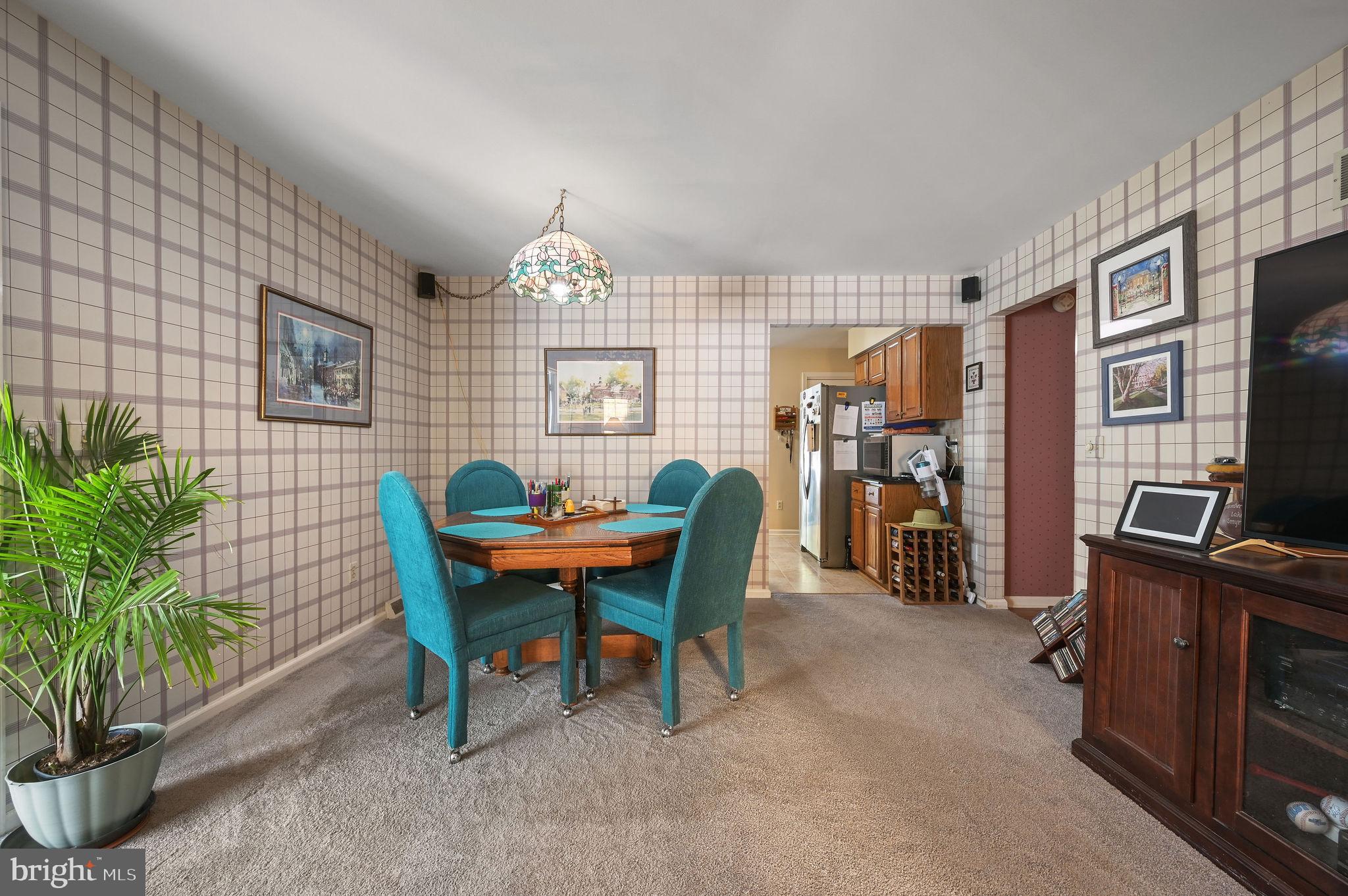 164 Burning Tree Road Dover, DE 19904 - Photo 16 of 37 a view of a workspace with furniture and a livingroom