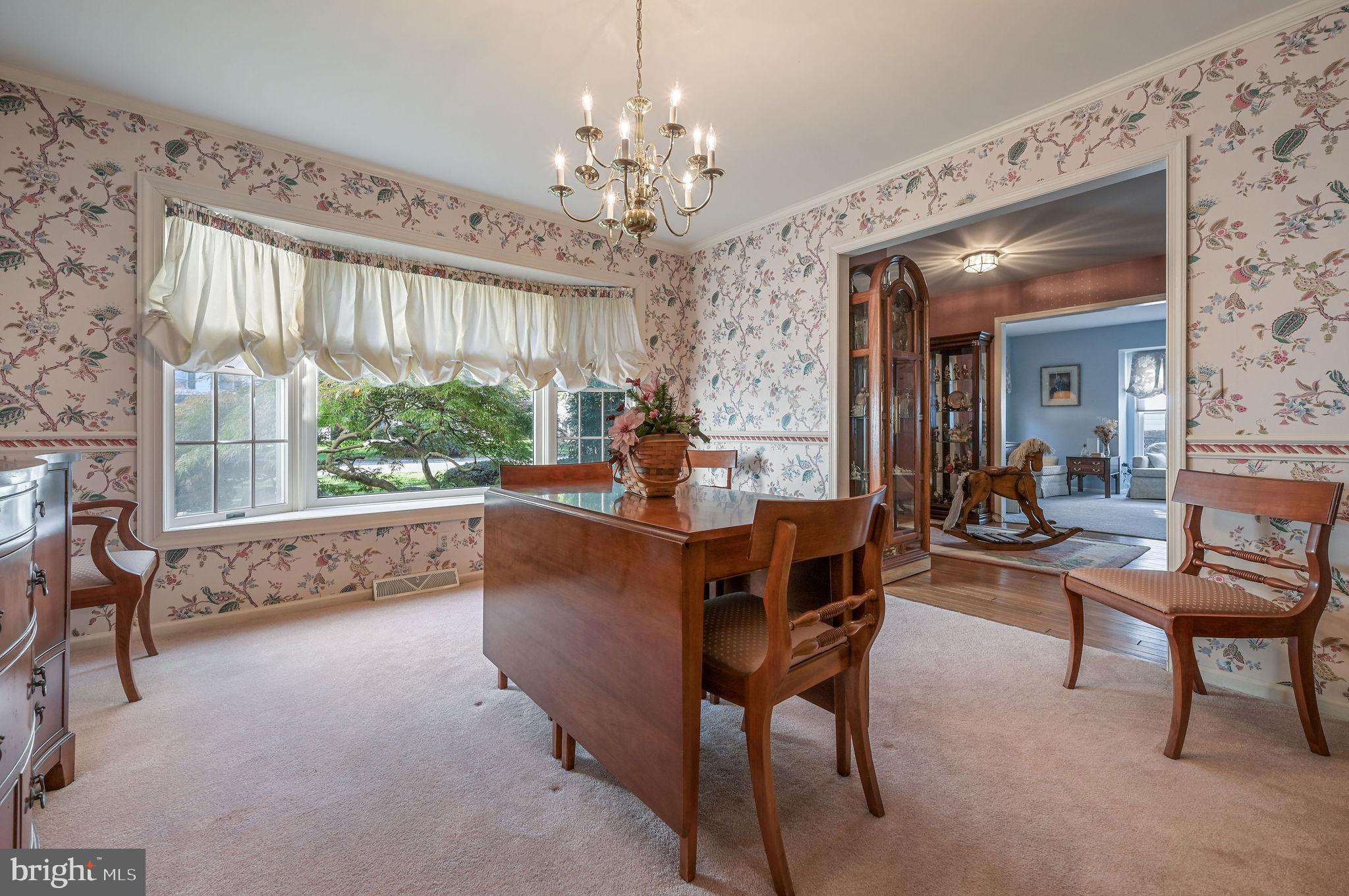 164 Burning Tree Road Dover, DE 19904 - Photo 20 of 37 a living room with furniture and a chandelier