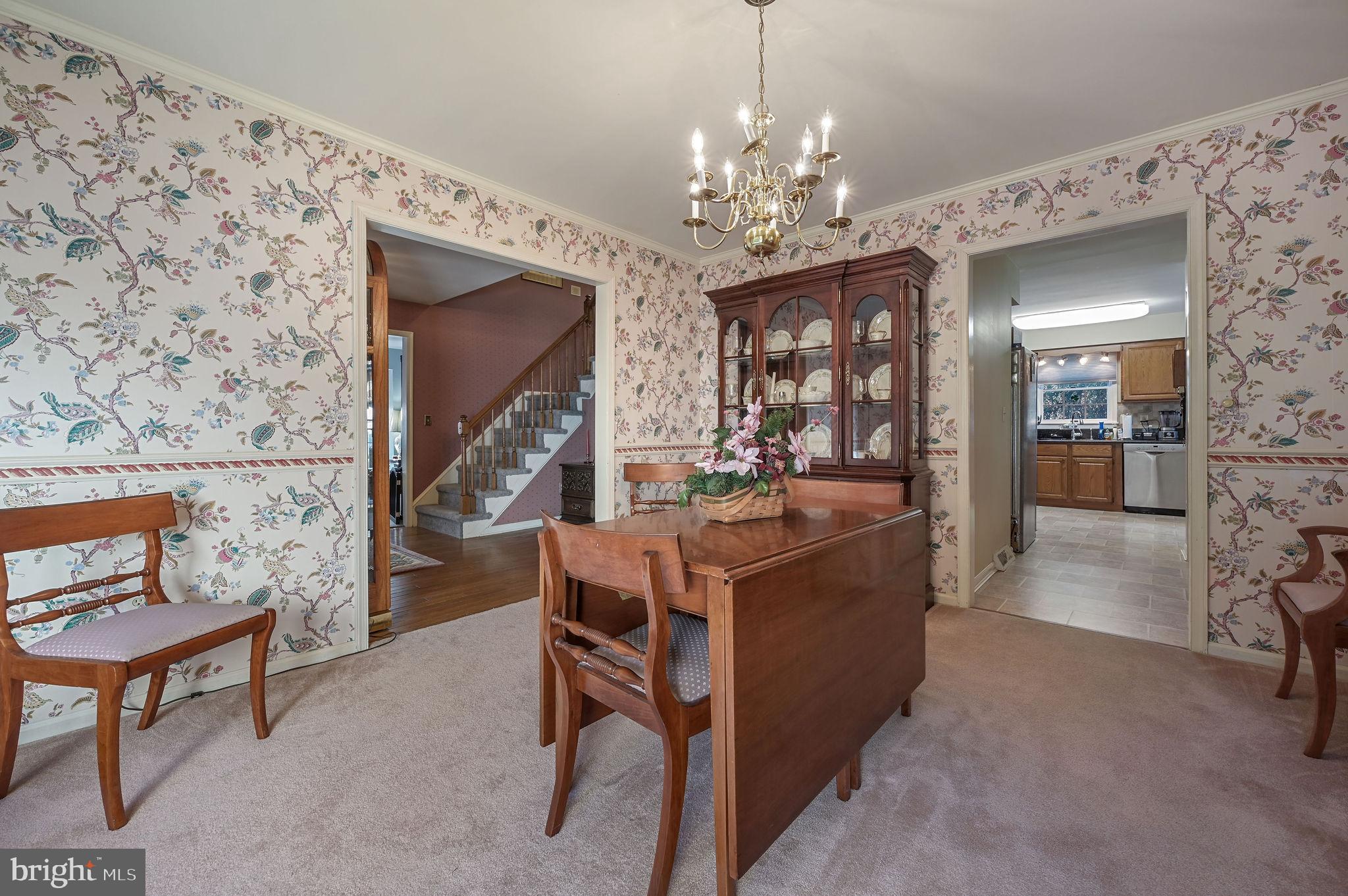 164 Burning Tree Road Dover, DE 19904 - Photo 21 of 37 a view of a dining room with furniture and a chandelier