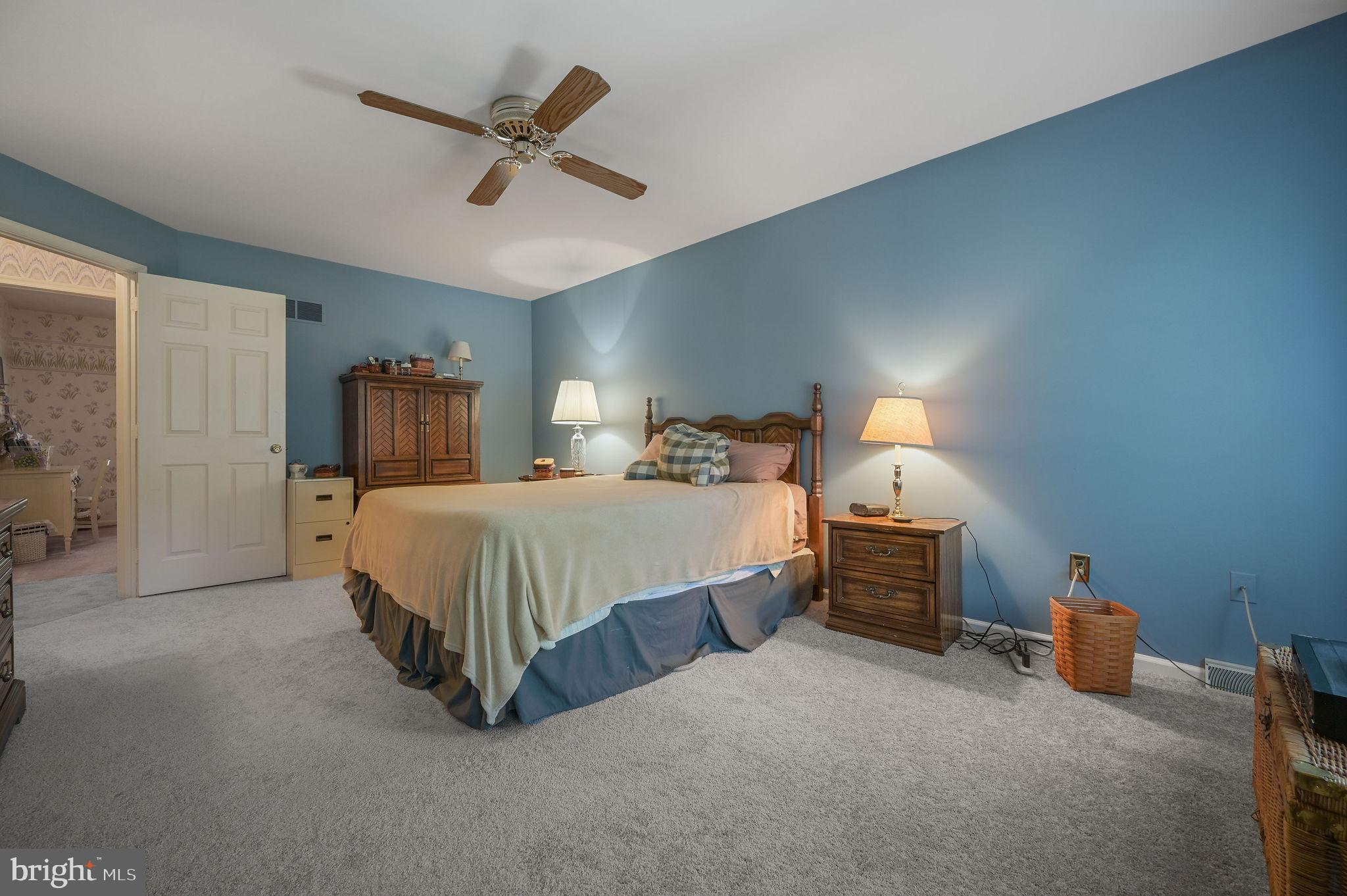 164 Burning Tree Road Dover, DE 19904 - Photo 30 of 37 a bed room with a bed and ceiling fan