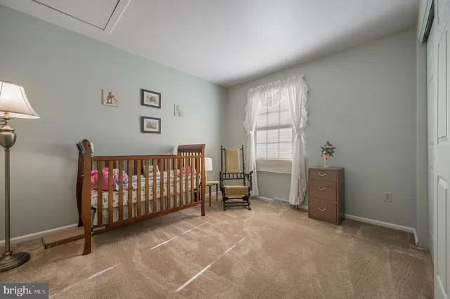 a bedroom with windows