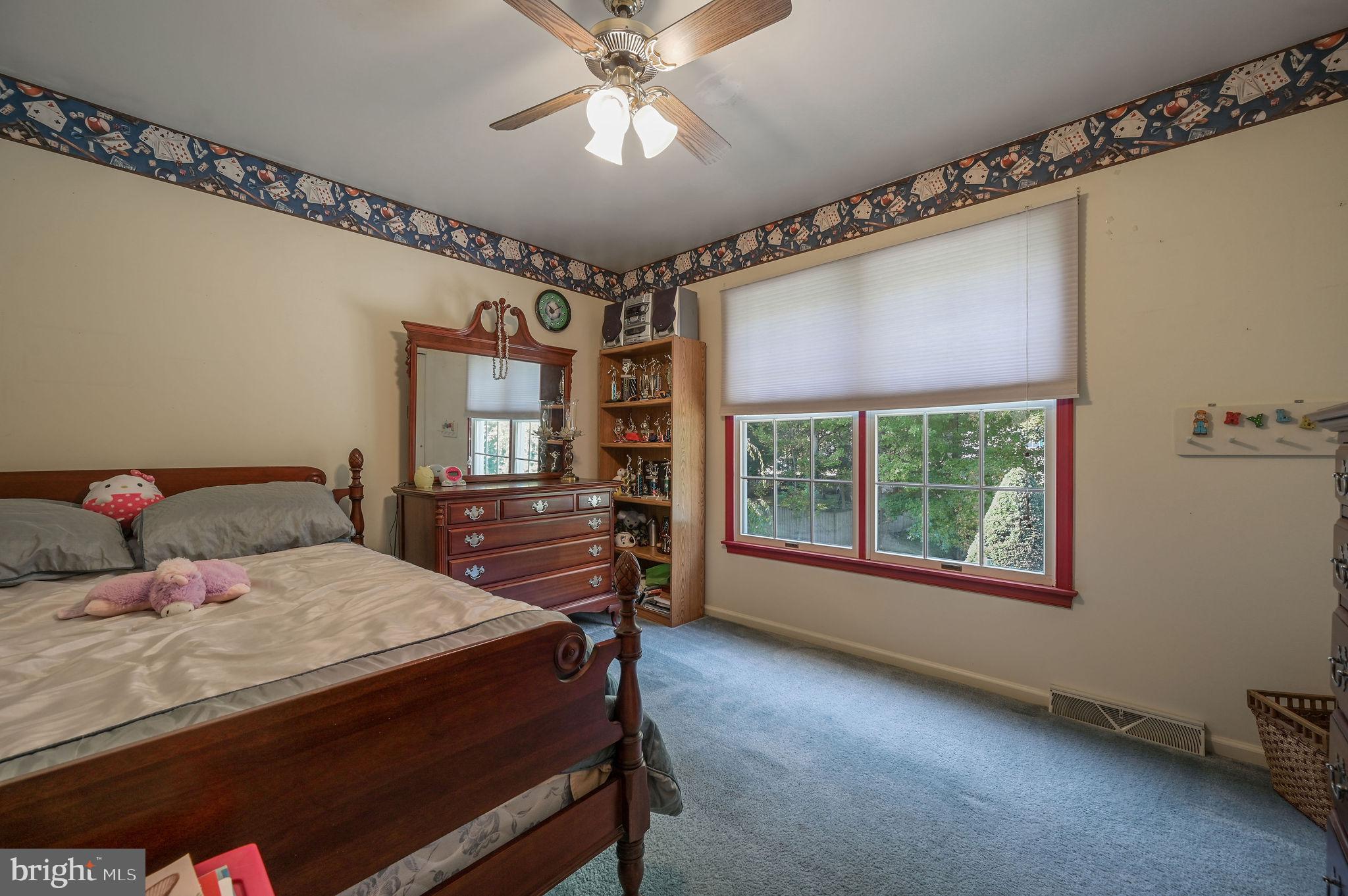 164 Burning Tree Road Dover, DE 19904 - Photo 33 of 37 a bedroom with a bed and a large window
