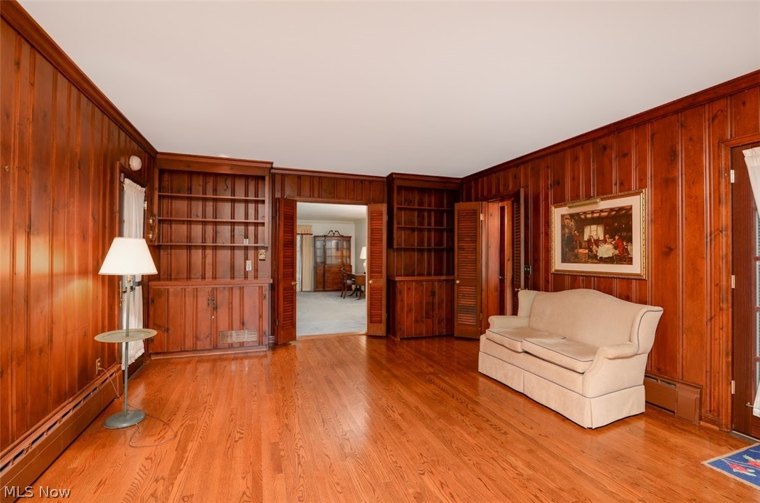 2330 Amesbury Road Akron, OH 44313 - Photo 13 of 35 From the living room, step into the expanded and beautifully paneled family room with built ins and gorgeous hardwood floors.