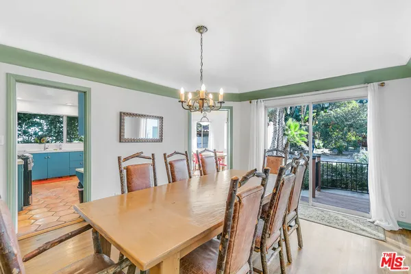 a view of a dining room with furniture and window