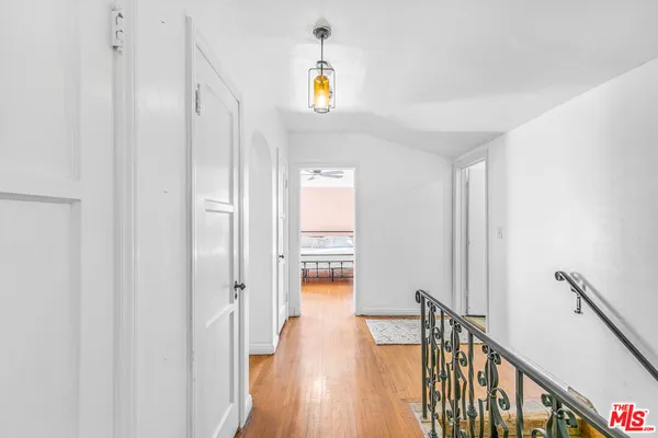a spacious bedroom with a bed and a walk in closet