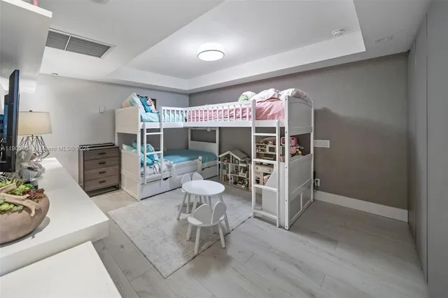 a living room with furniture a dining table and a large window