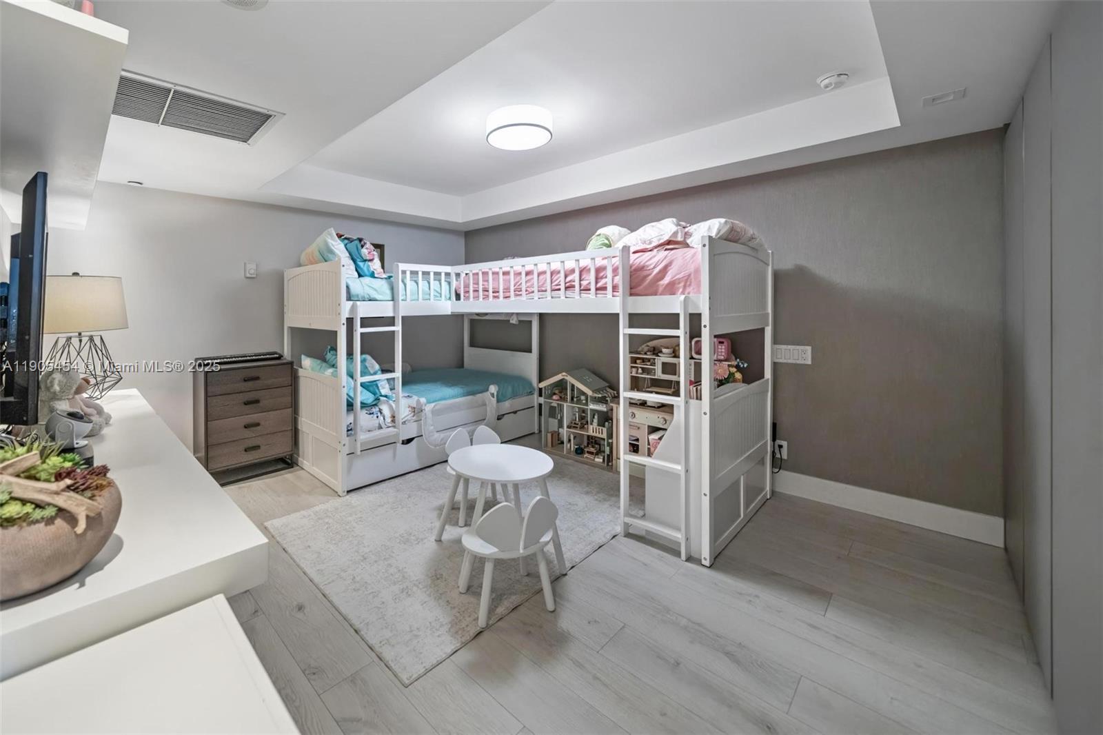 2301 Collins Avenue, Unit 1414/1415 Miami Beach, FL 33139 - Photo 12 of 40 a living room with furniture a dining table and a large window