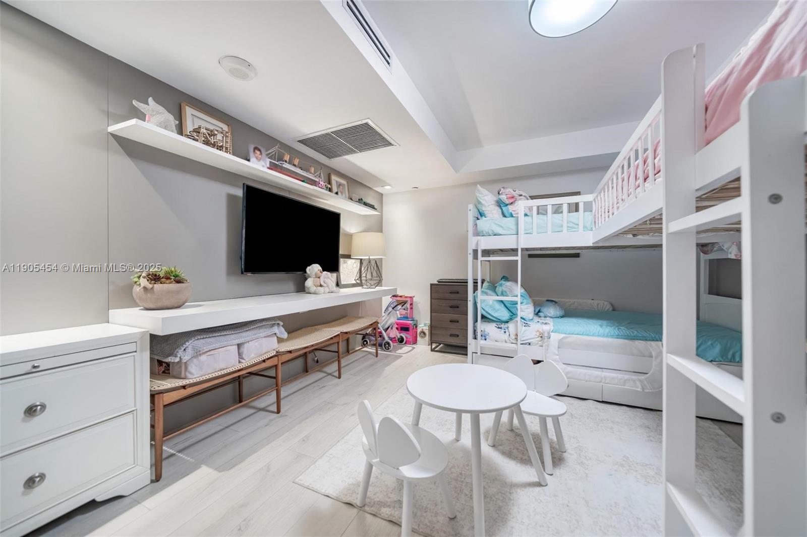 2301 Collins Avenue, Unit 1414/1415 Miami Beach, FL 33139 - Photo 13 of 40 a bathroom with a sink a toilet and a mirror