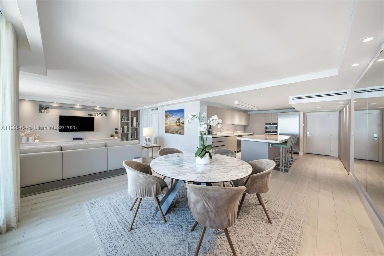 2301 Collins Avenue, Unit 1414/1415 Miami Beach, FL 33139 - Photo 15 of 40 a view of a dining room with furniture and wooden floor