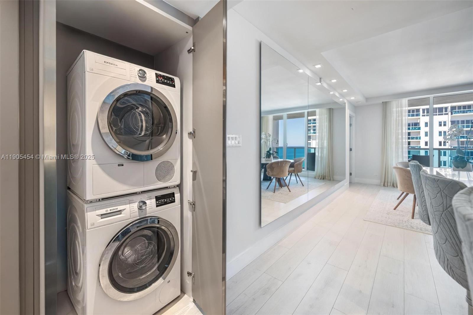 2301 Collins Avenue, Unit 1414/1415 Miami Beach, FL 33139 - Photo 19 of 40 a view of a hallway with washer and dryer