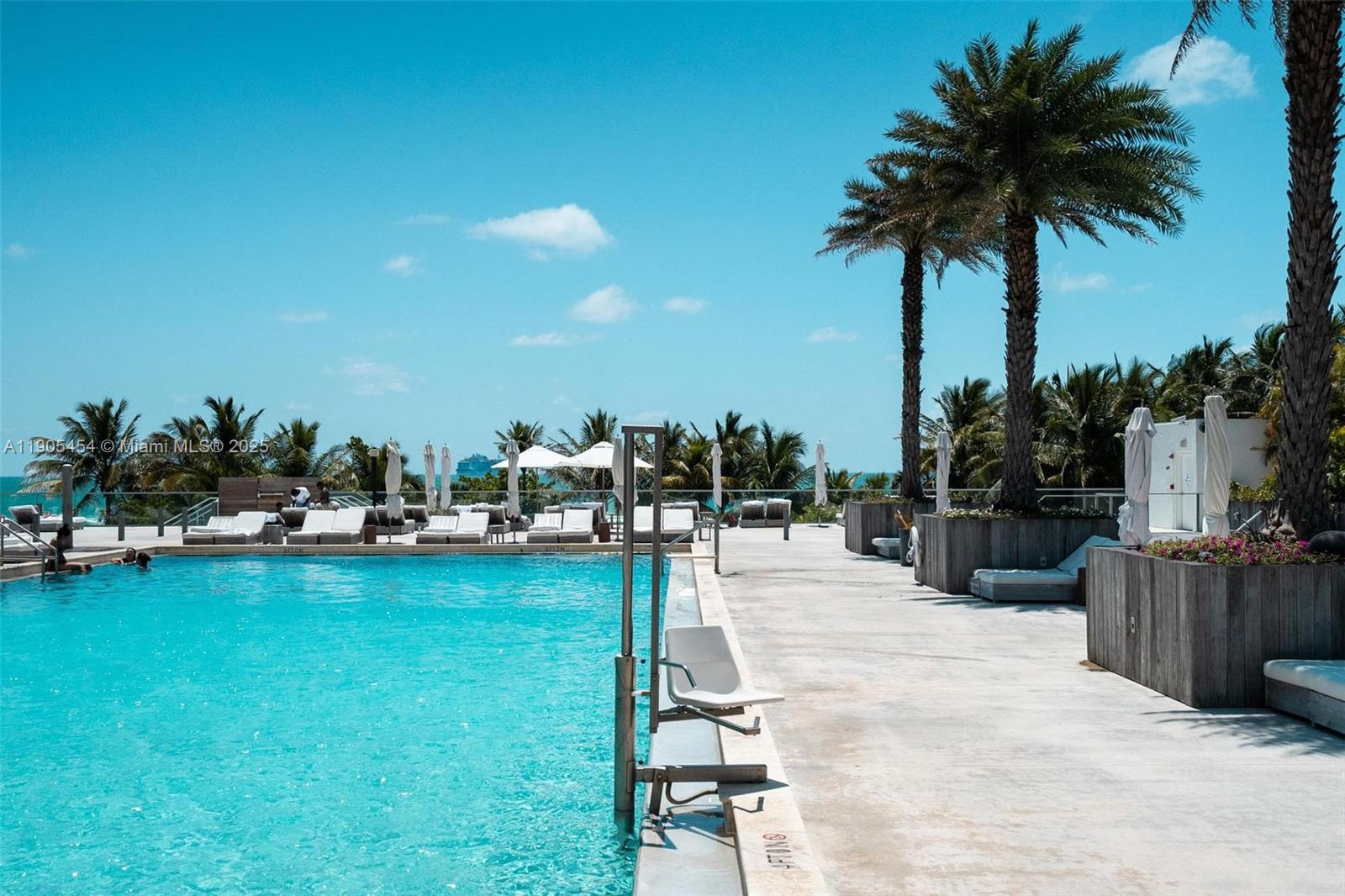2301 Collins Avenue, Unit 1414/1415 Miami Beach, FL 33139 - Photo 30 of 40 a view of a swimming pool and lounge chair