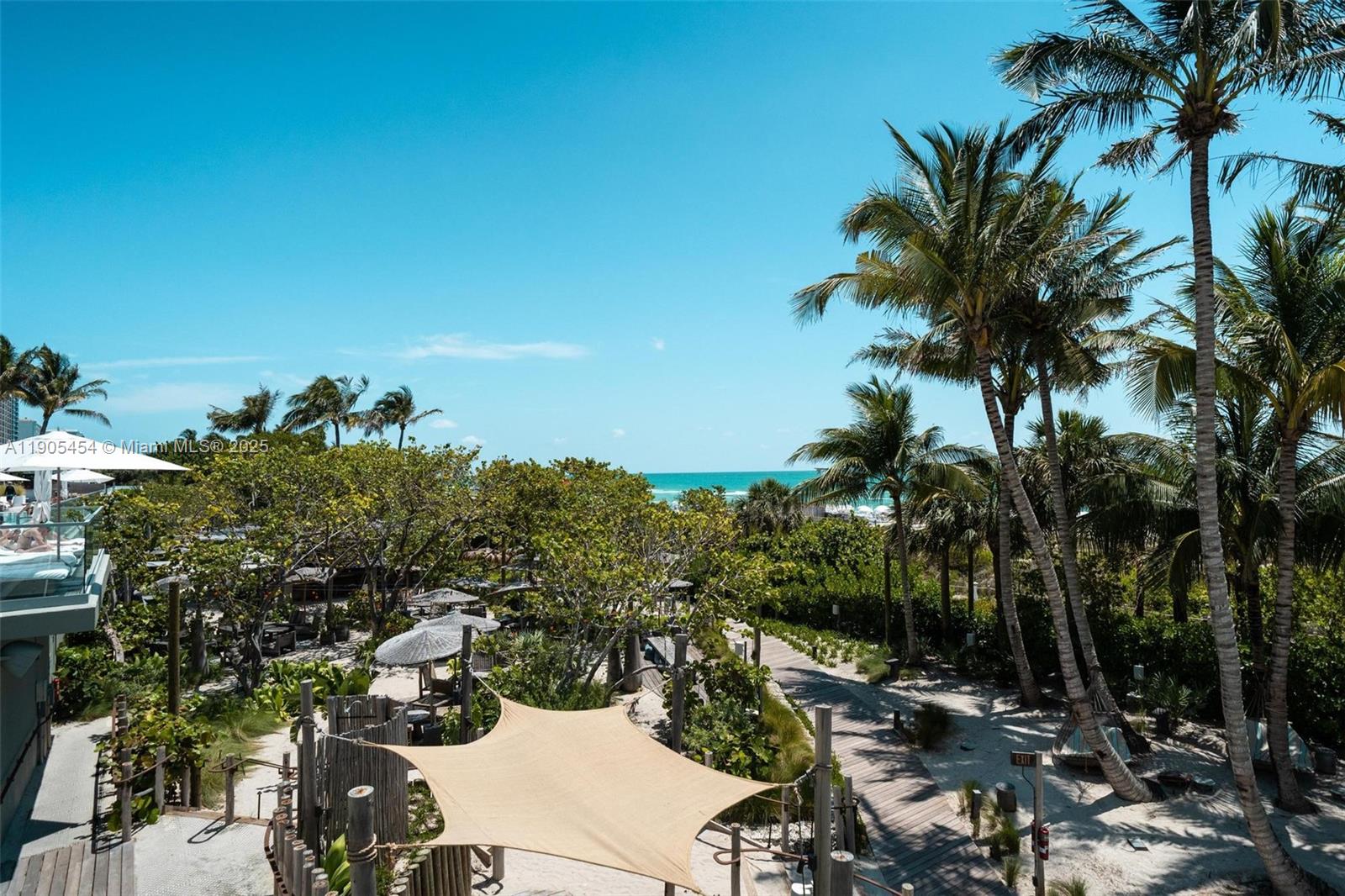 2301 Collins Avenue, Unit 1414/1415 Miami Beach, FL 33139 - Photo 32 of 40 a view of a yard with palm trees