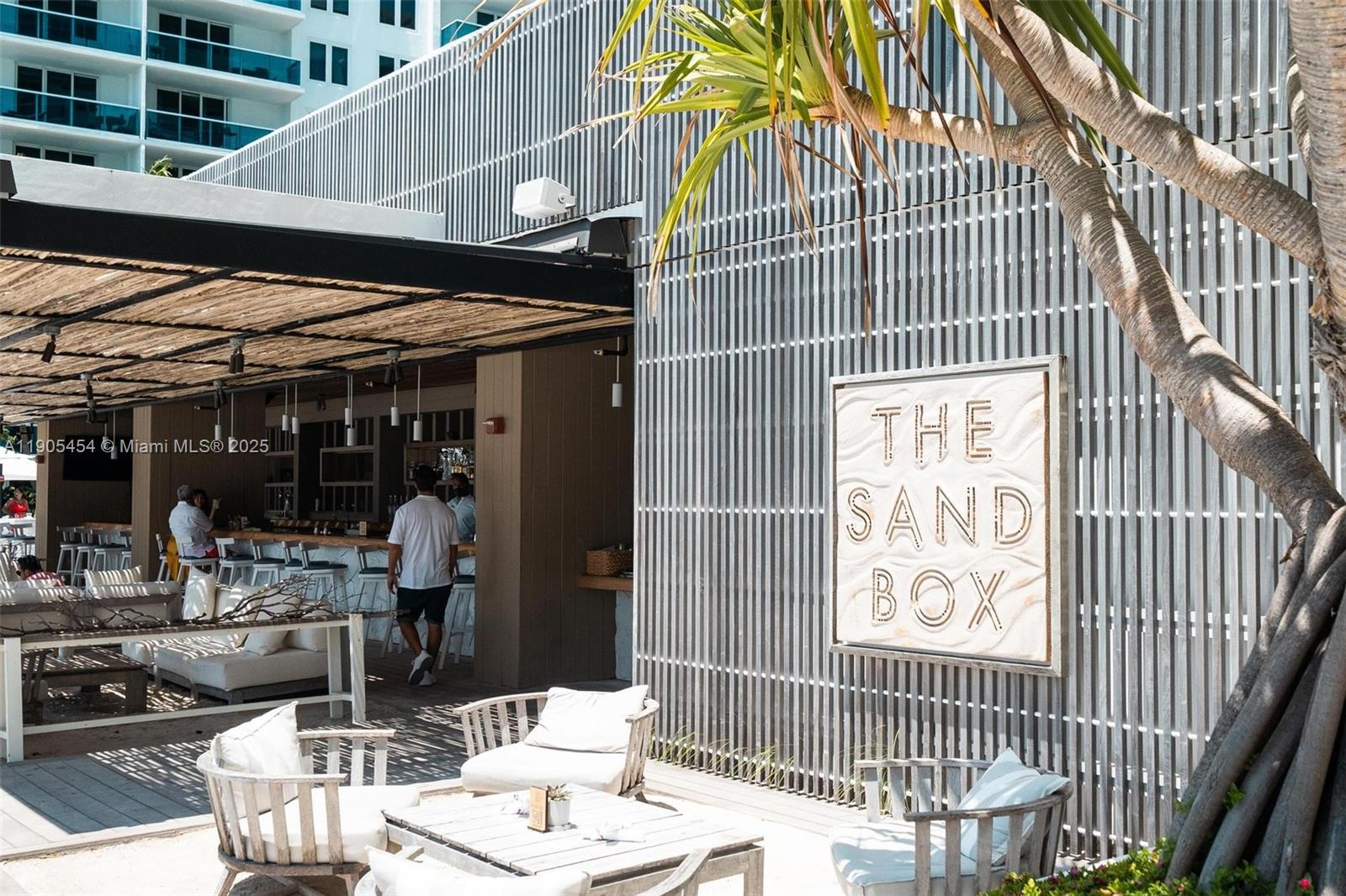 2301 Collins Avenue, Unit 1414/1415 Miami Beach, FL 33139 - Photo 37 of 40 a view of a dinning tables and chair in the balcony