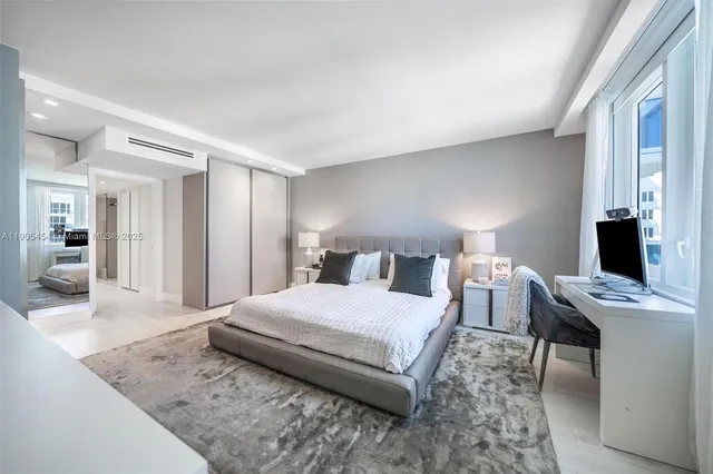 a bedroom with a bed and a desk