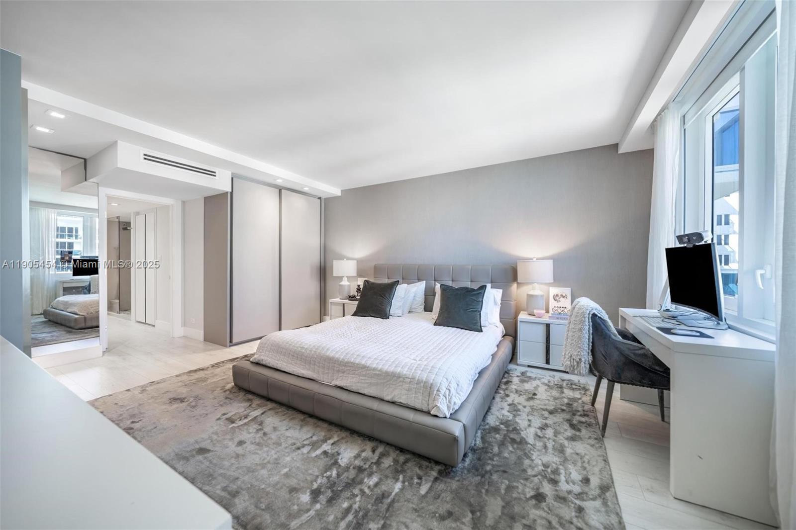 2301 Collins Avenue, Unit 1414/1415 Miami Beach, FL 33139 - Photo 9 of 40 a bedroom with a bed and a desk