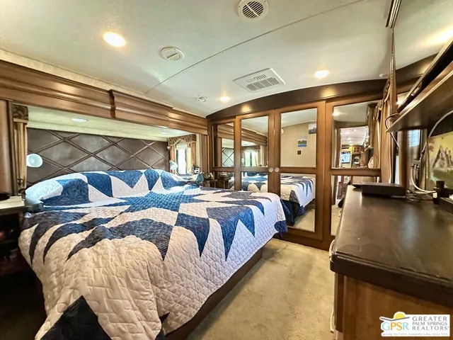 a bedroom with bed and a window