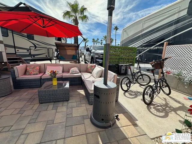 a view of yard with patio