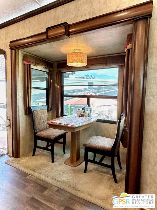 69801 Ramon Road, Unit 266 Cathedral City, CA 92234 - Photo 10 of 23 a view of a dining room with furniture and window