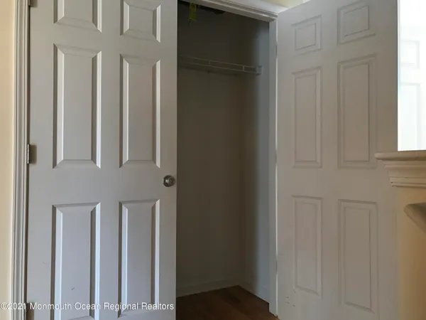 a view of a hallway with windows