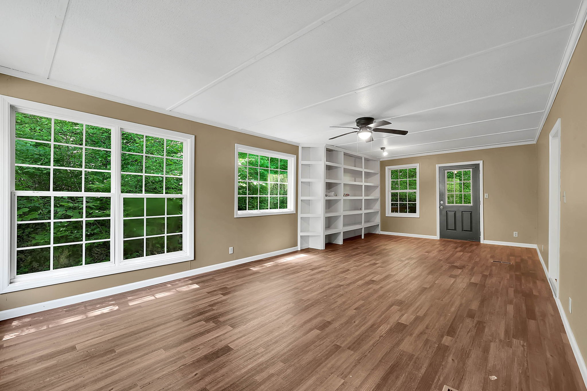 660 Rogues Fork Road Bethpage, TN 37022 - Photo 11 of 55 a view of an empty room with a window and wooden floor