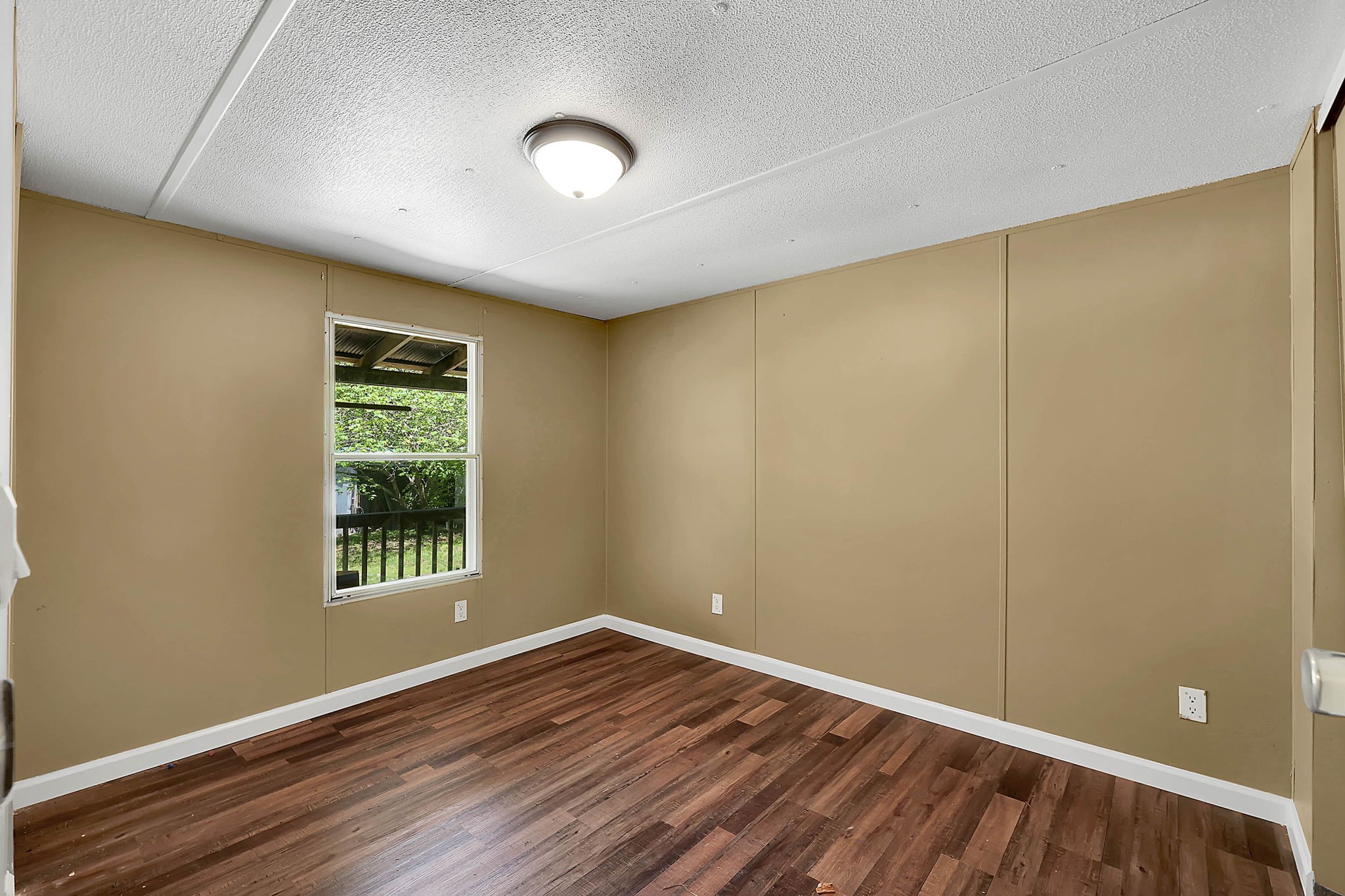 660 Rogues Fork Road Bethpage, TN 37022 - Photo 15 of 55 an empty room with wooden floor and windows