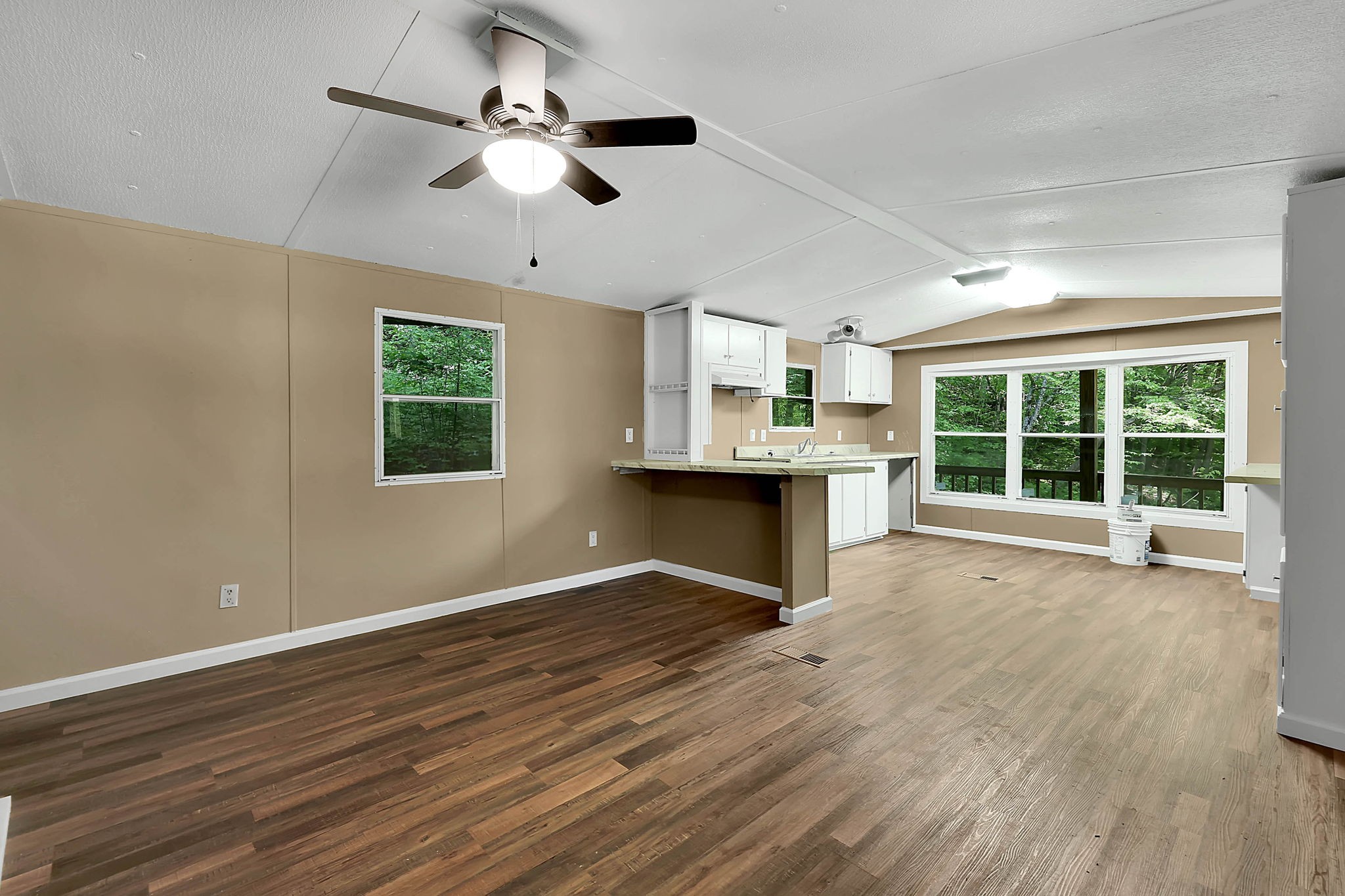 660 Rogues Fork Road Bethpage, TN 37022 - Photo 19 of 55 a view of an empty room with a window and wooden floor