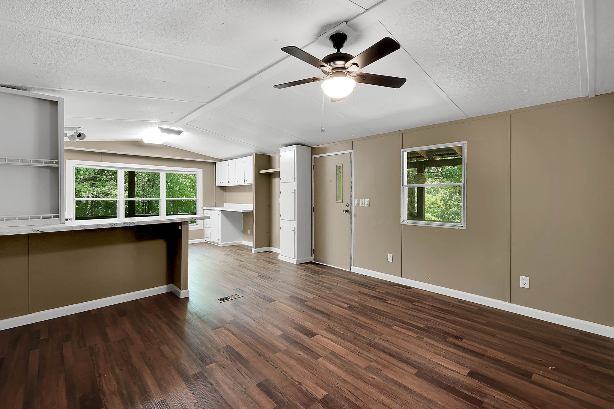 660 Rogues Fork Road Bethpage, TN 37022 - Photo 20 of 55 a view of an empty room with wooden floor and a window