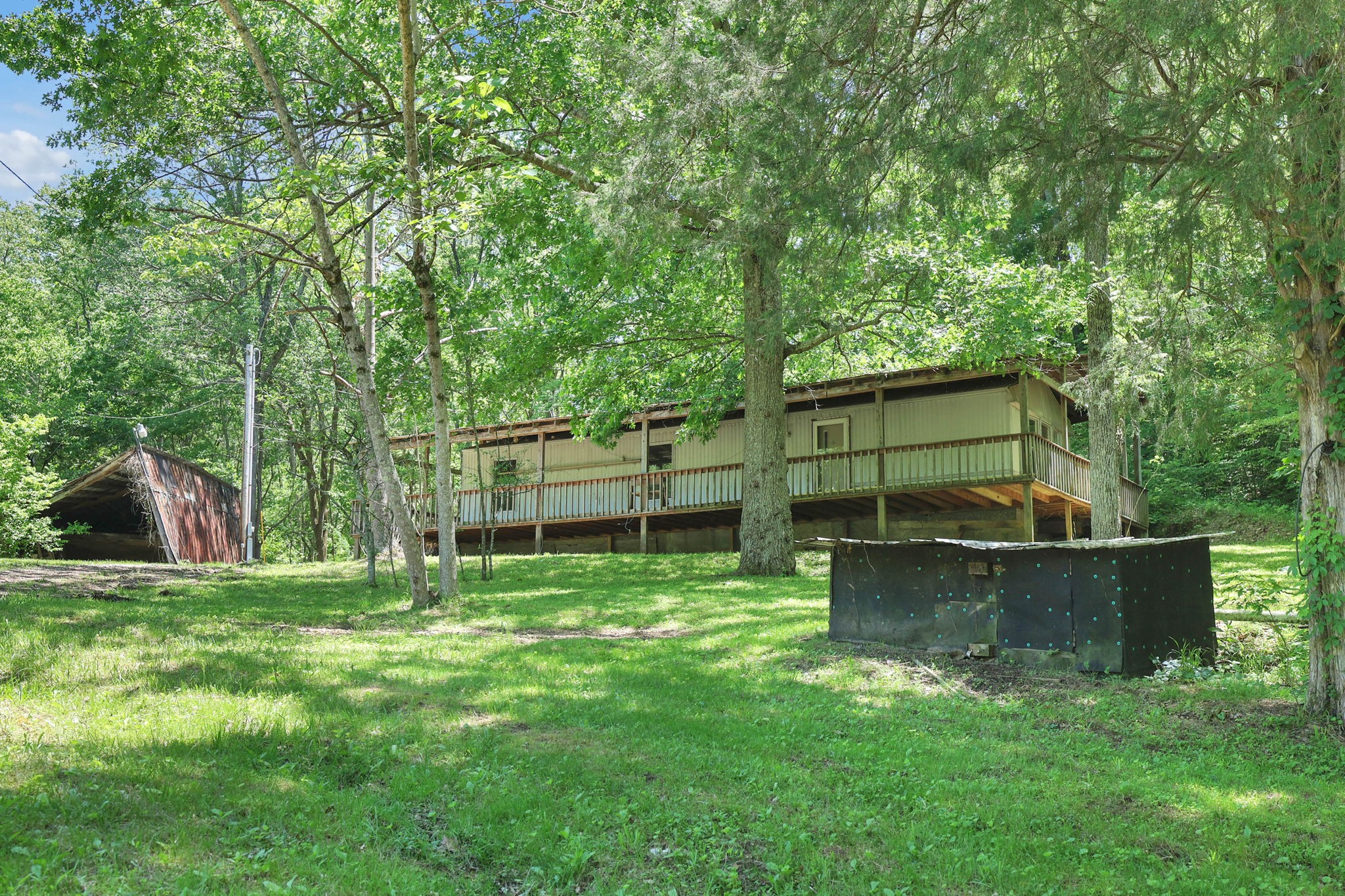 660 Rogues Fork Road Bethpage, TN 37022 - Photo 10 of 55 a backyard of a house with barbeque oven