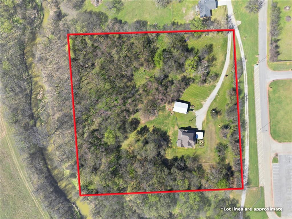 130 Parsonage Street Azle, TX 76020 - Photo 25 of 39 Aerial view of property and surrounding area with property parcel outlined