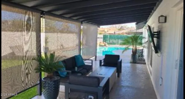 a outdoor living space with furniture and a potted plant